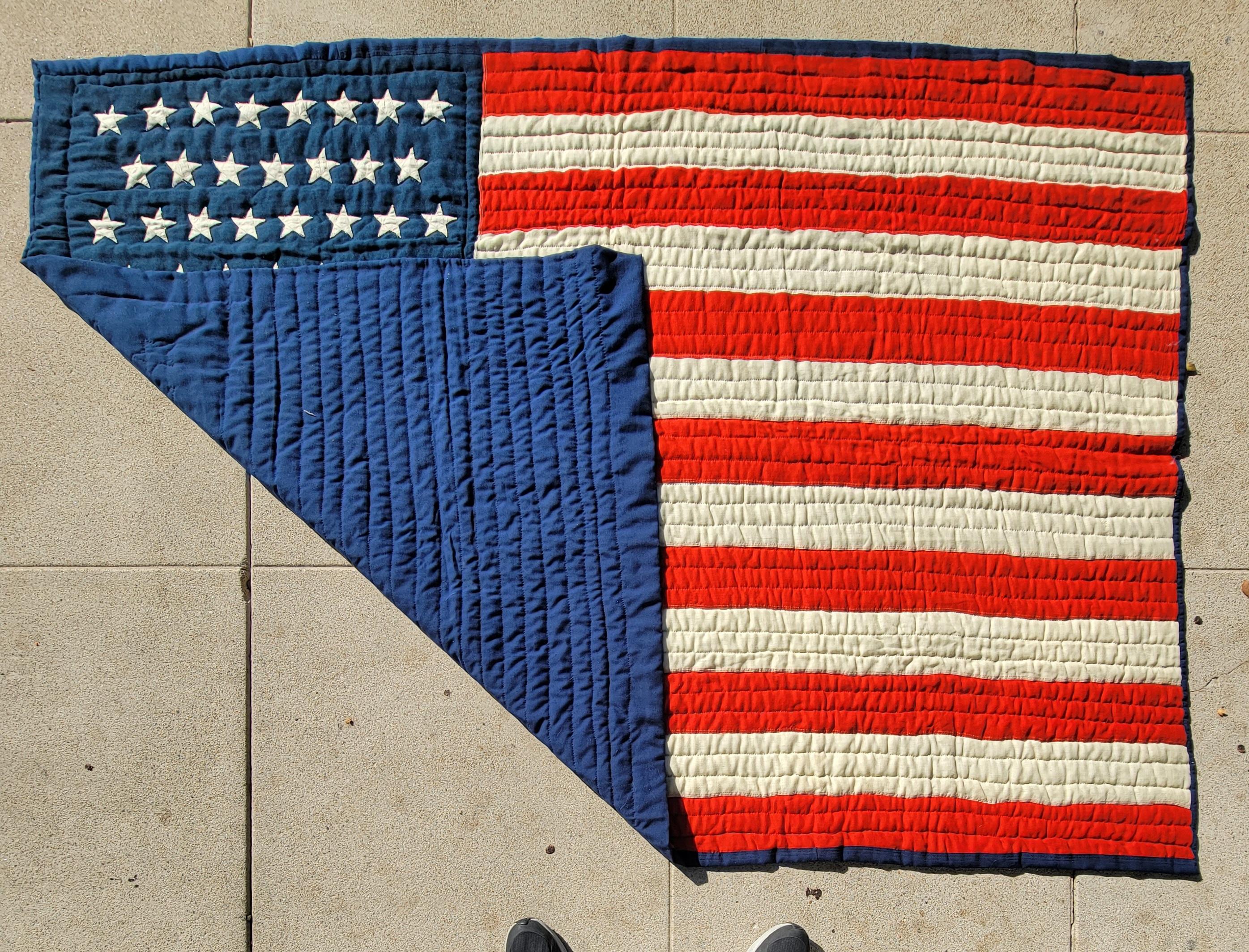 This most unusual wool flag quilt with 45 stars and all hand sewn & quilted through out.The condition is very good and has a blue cotton backing that matches the blue in the front of the flag. This is such a folky and most unusual flag quilt.From a