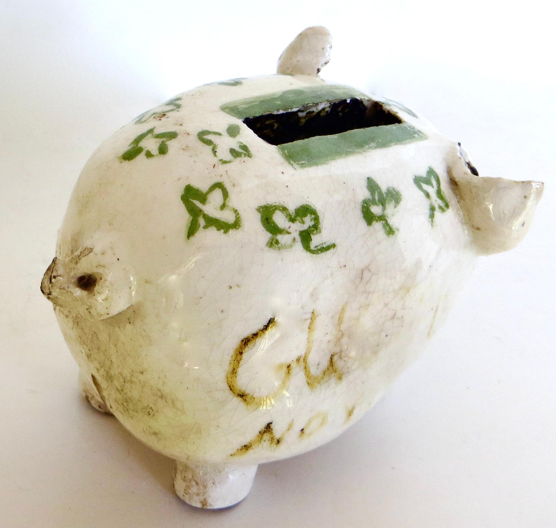 This is a very unique and rare item and quite collectible in that the primary purpose of the bank was to provide a safe method to dispose of used razor blades at the turn of the 19th to 20th century to prevent accidental cuts or injuries; and, was