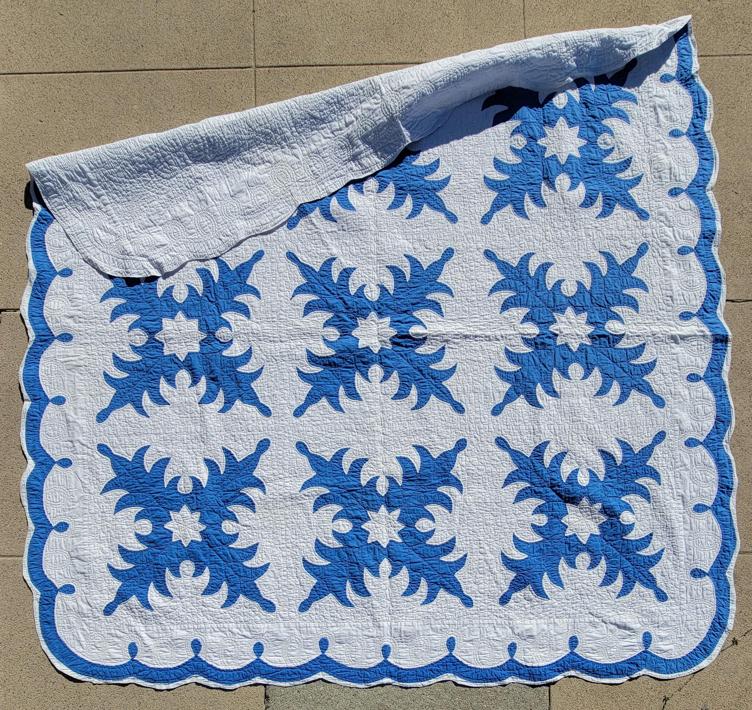 This fine quilted and nicely pieced snow flake applique blue & white quilt with a great scalloped border.Hand pieced and sewn edging. Robin egg blue & white quilt from Ohio.