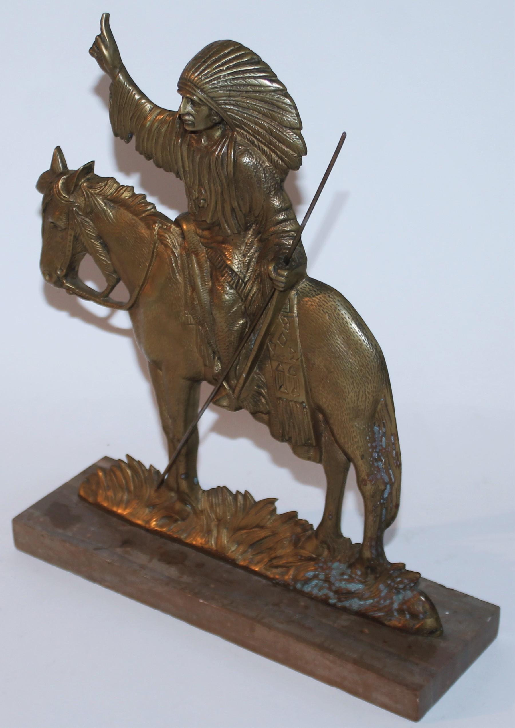 This amazing bronze Indian rider on horseback sculpture is mounted on a marble base in very good condition. It has a wonderful undisturbed patina and great looking. The sculpture is unsigned.