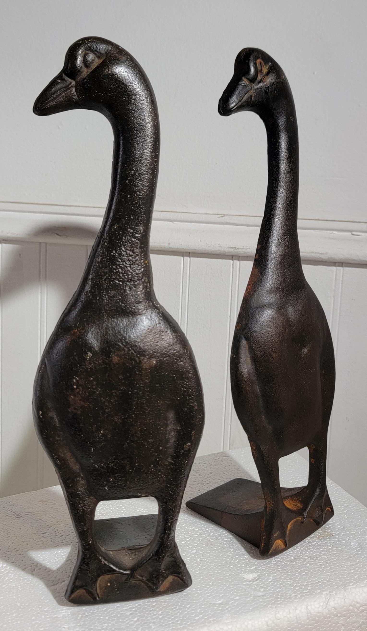 Early 20thc cast iron Duck Door Stops/ bookends. Great weight, heavy. Wonderful shape and size. These are great accents to any collection. 

Great patina to both. 
Honest wear from age and use, 