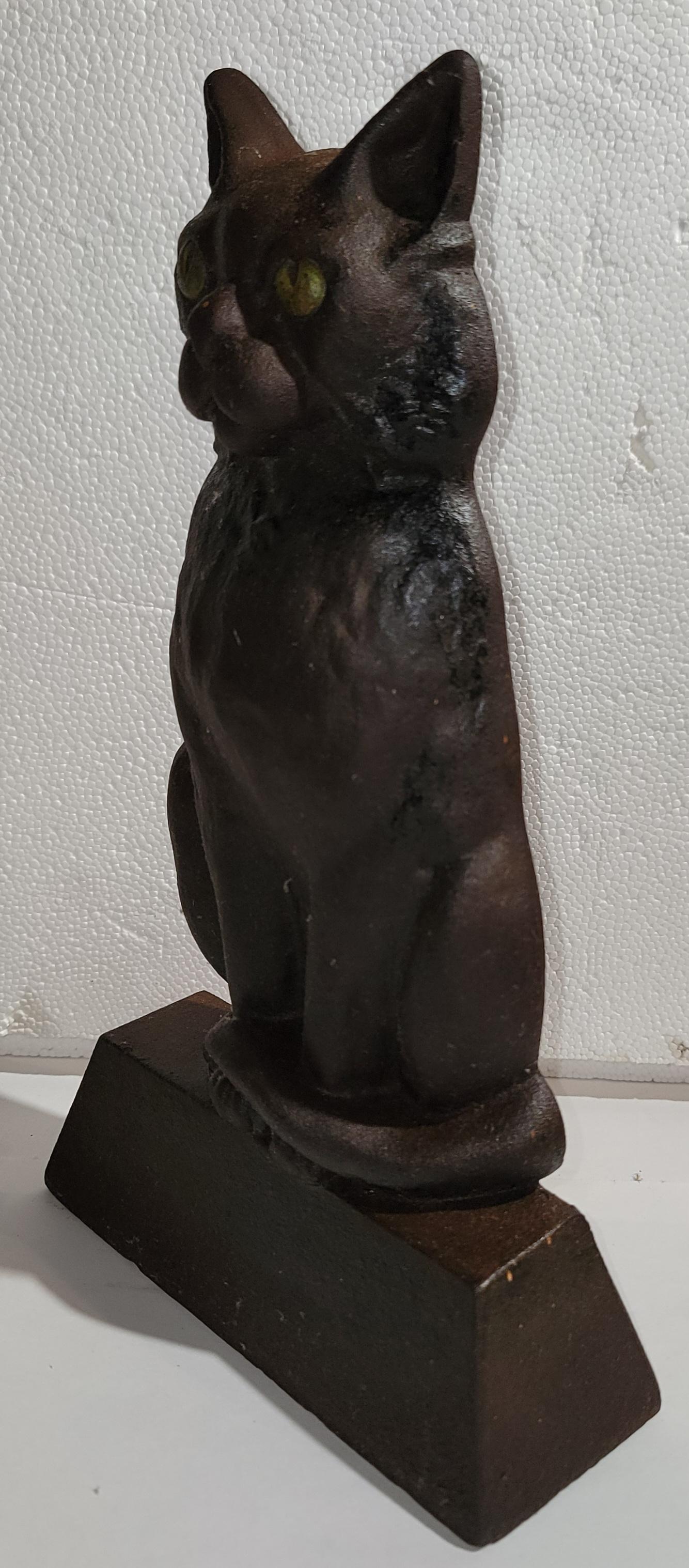 Gato Hubley de hierro fundido de principios del siglo XX  tope de puerta en buen estado.los ojos pintados a mano.se trata de un tope de puerta muy pesado.