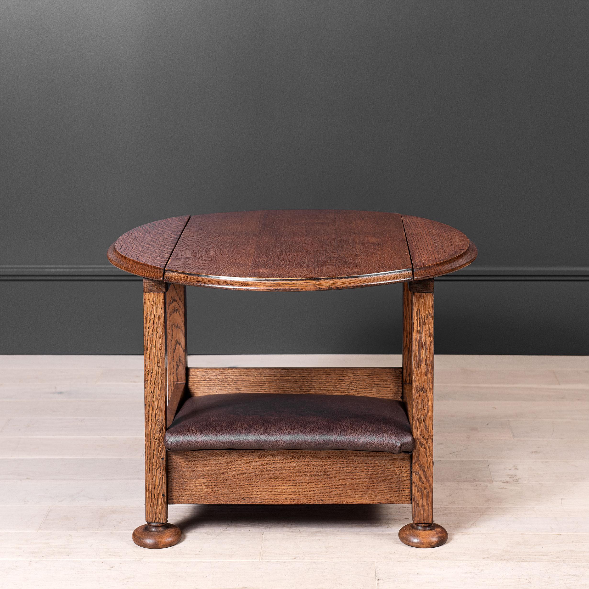 A singular piece of early 20th Century furniture. Diminutive metamorphic English oak chair table. A very unusual version of a rarely seen item.
The central panel of the circular table top slides back and then pivots down to form the seat back. A