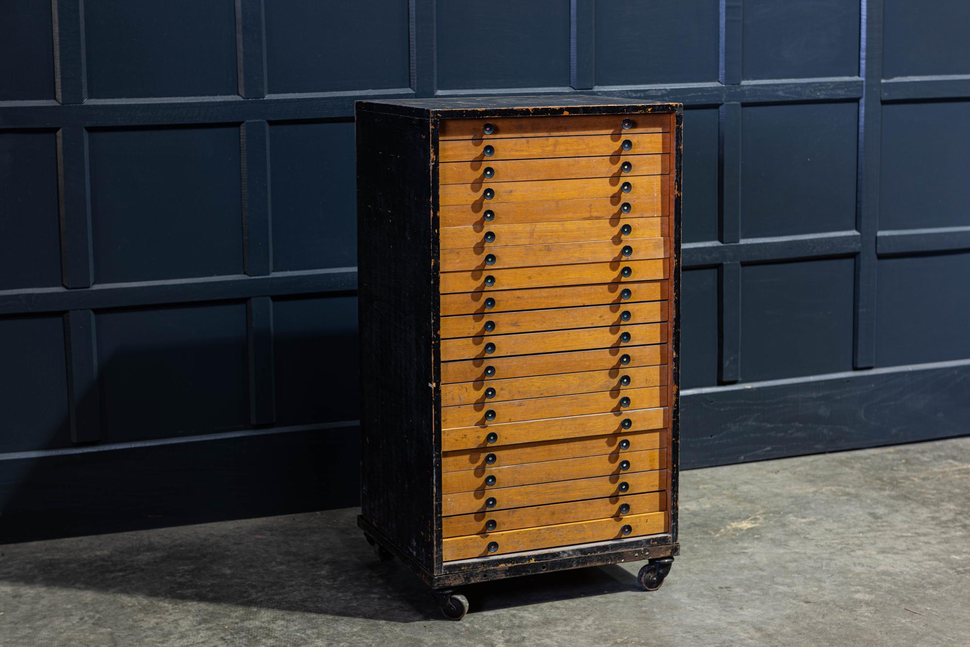 Early 20th century English printers letter press collectors cabinet
circa 1930.

Early 20th century printers collectors cabinet.

20-drawer cabinet originally built to house the brass letters for a Taylor, Taylor & Hobson Pantograph Engraving