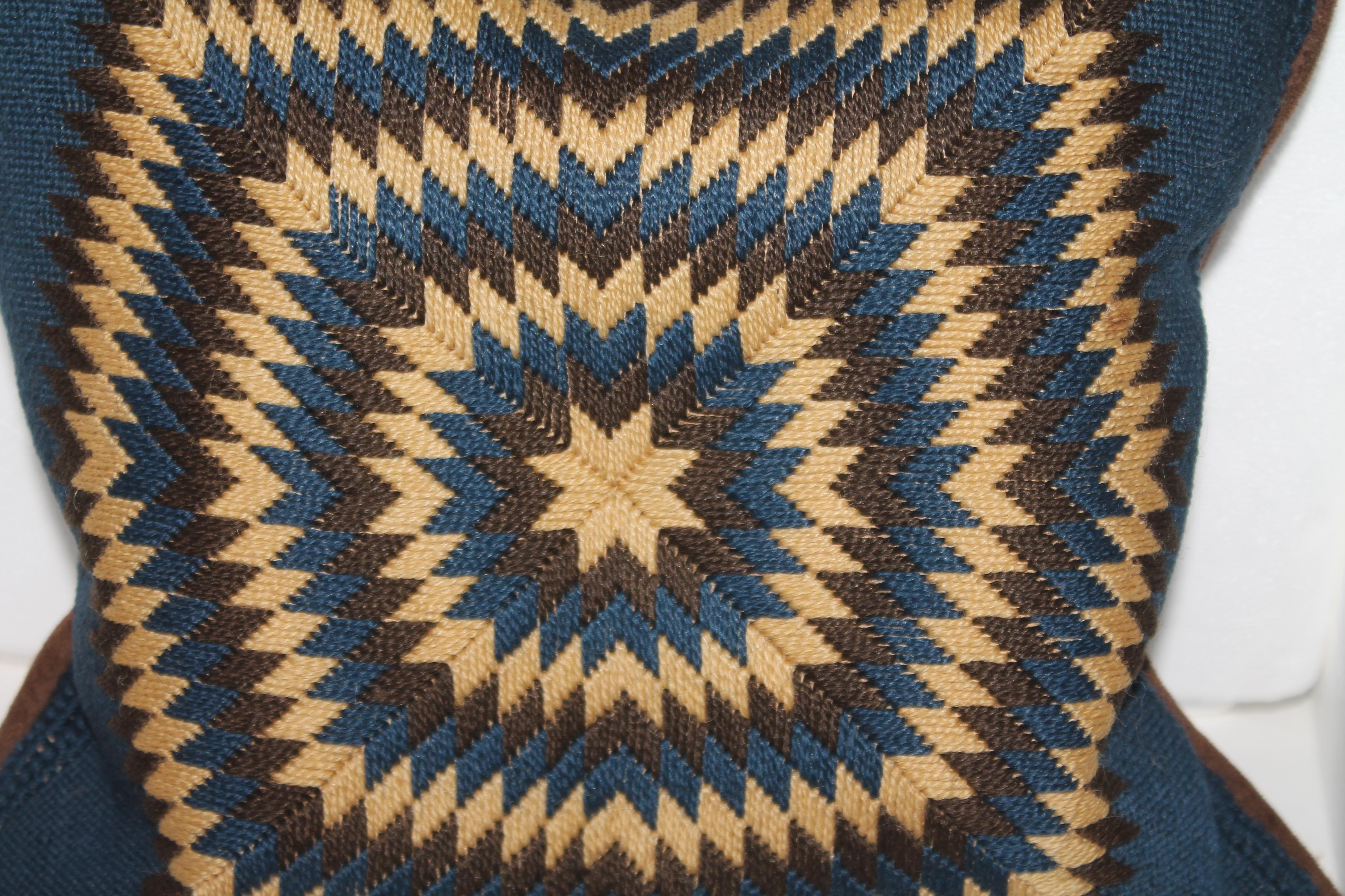 Early handwoven or knit starburst pillow. The backing is in a vintage velvet. The insert is down & feather fill.