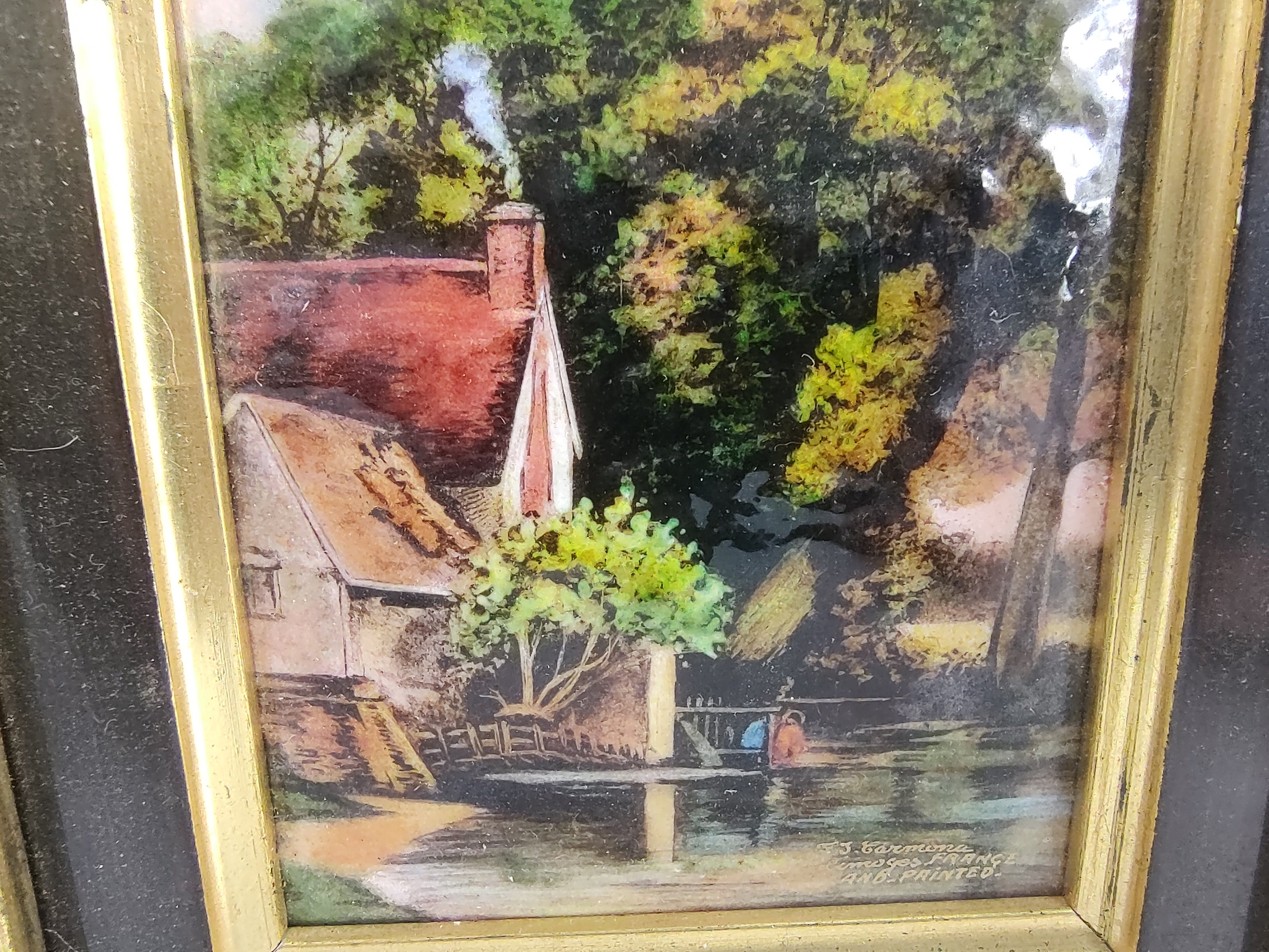 Simple & elegant hand painted enamel on copper of a French cottage by a pond with dock. Petite in size, work of art is 3.5 x 5. Totality is 10.5 x 9.5 framed. In excellent antique condition with minimal wear to the frame. Work of art is signed E.