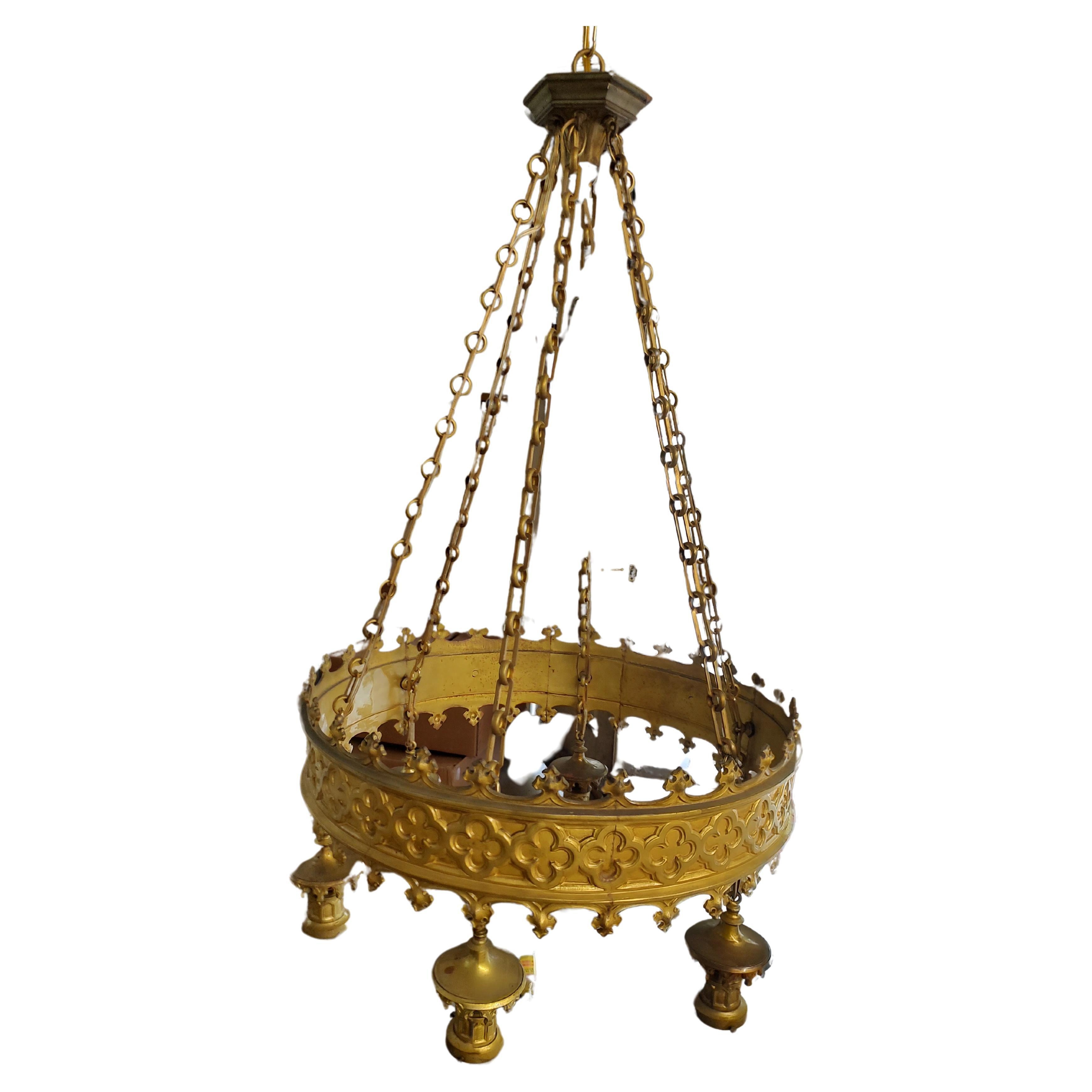 Fabulous 6 light solid cast brass chandelier from a New Jersey Theater Lobby. Totally rewired with new candelabra sockets and with new chain. In excellent antique condition. It's a stunning beautiful chandelier.