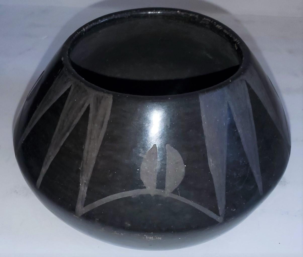 This Native American Indian pot or bowl has a very unusual geometric design. The condition is very good with wear consistent from age and use to the base.