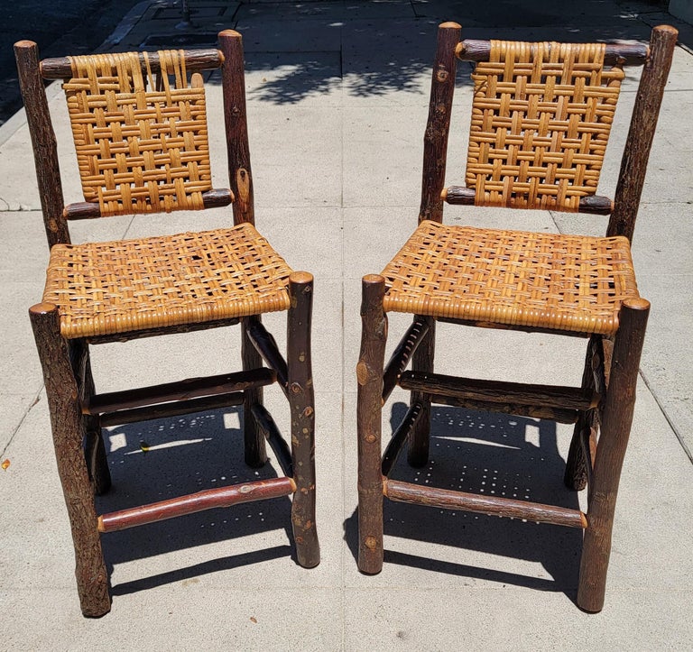 These Old Hickory Bar stools are in fine sturdy condition and very heavy. The condition are very good and there is minor loss in one stools woven back . It does not take away from the strength or beauty of the bar stool. It is very hard to find
