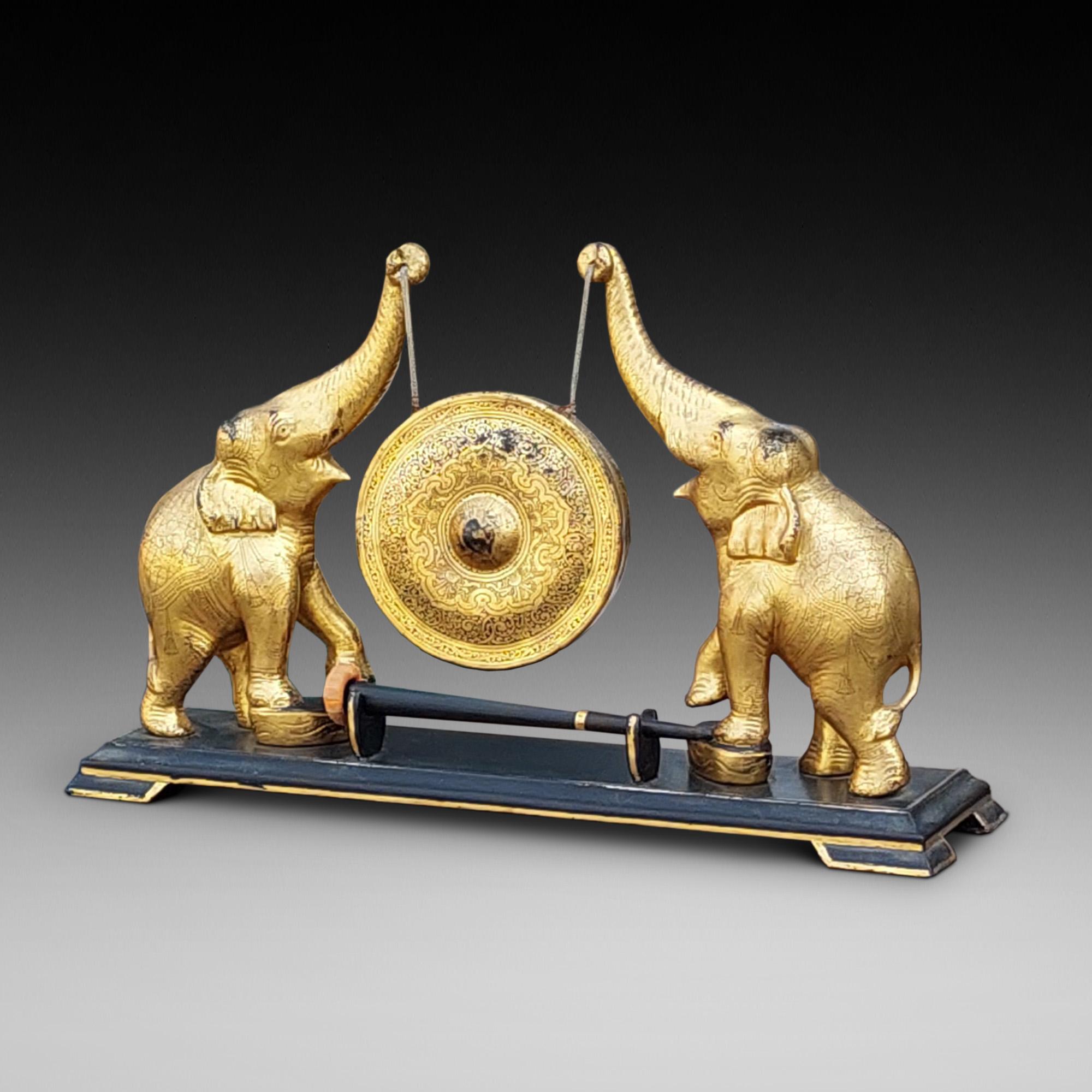 Early 20thC Oriental Brass & Hardwood Gong supported by two ceremonially dressed elephants - 22.5