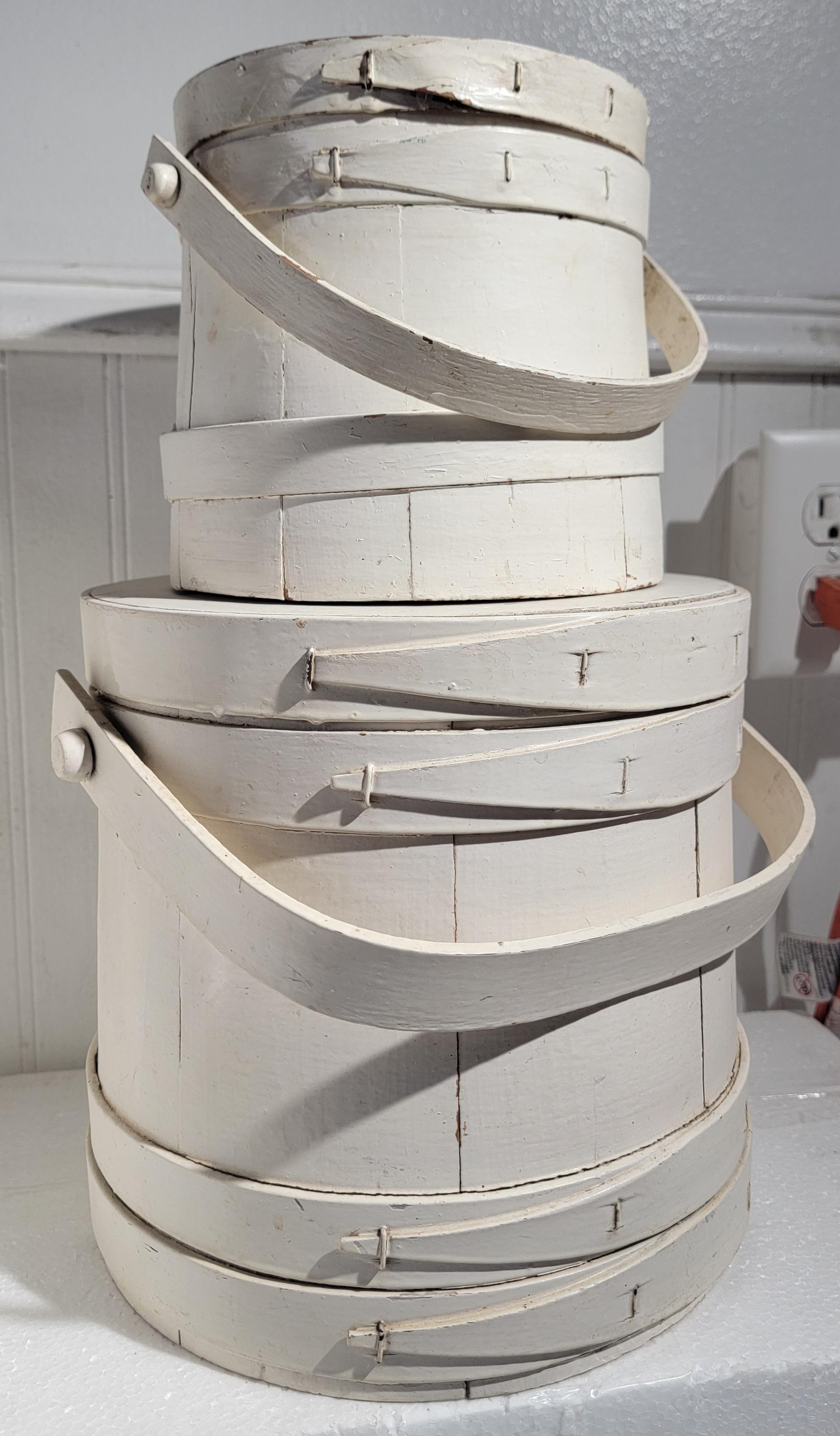 Early 20thc Original white painted furkins. Shaker  style made wooden furkins. Beautiful construction. 

Smaller furkin Diameter 8 x 6 height
Larger furkin 11 diameter x 9 height