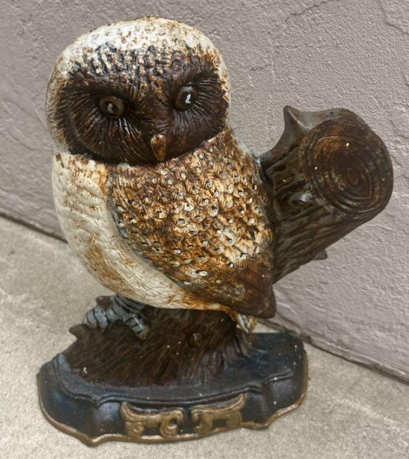 This amazing original painted owl early 20thc cast iron doorstop is in good condition.It has minor paint loss and is very heavy.Most unusual doorstop.