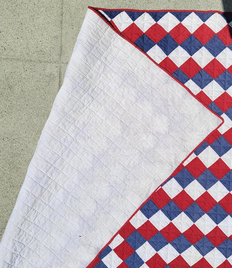 Early 20th C multi pieced patriotic trip around the world quilt. This fun quilt was found in Ohio.