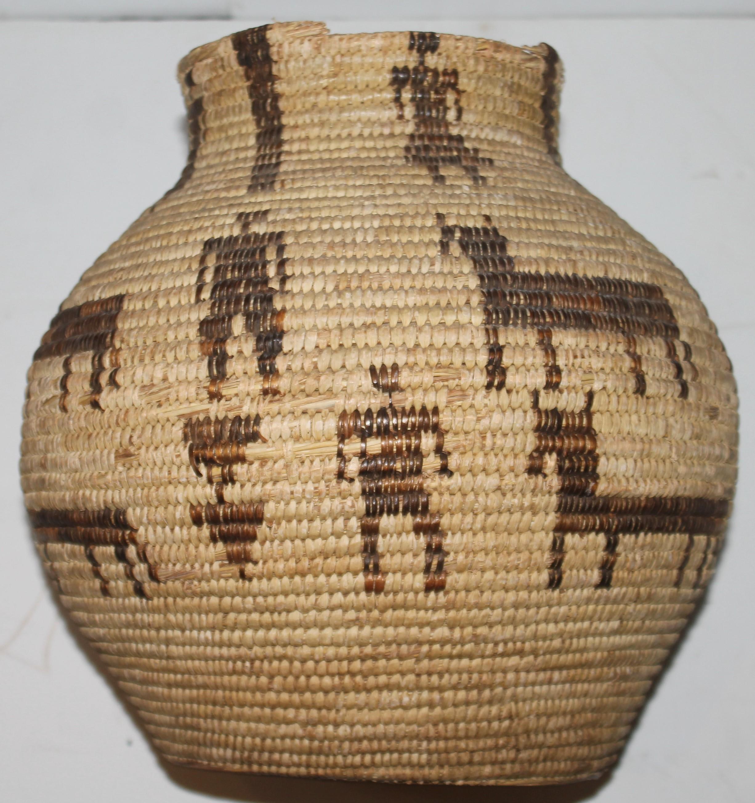 This fine American Indian Pima pictorial basket is in fine condition except some roughness around the top edge of the basket. The base has some minor glue in areas from another private collector.