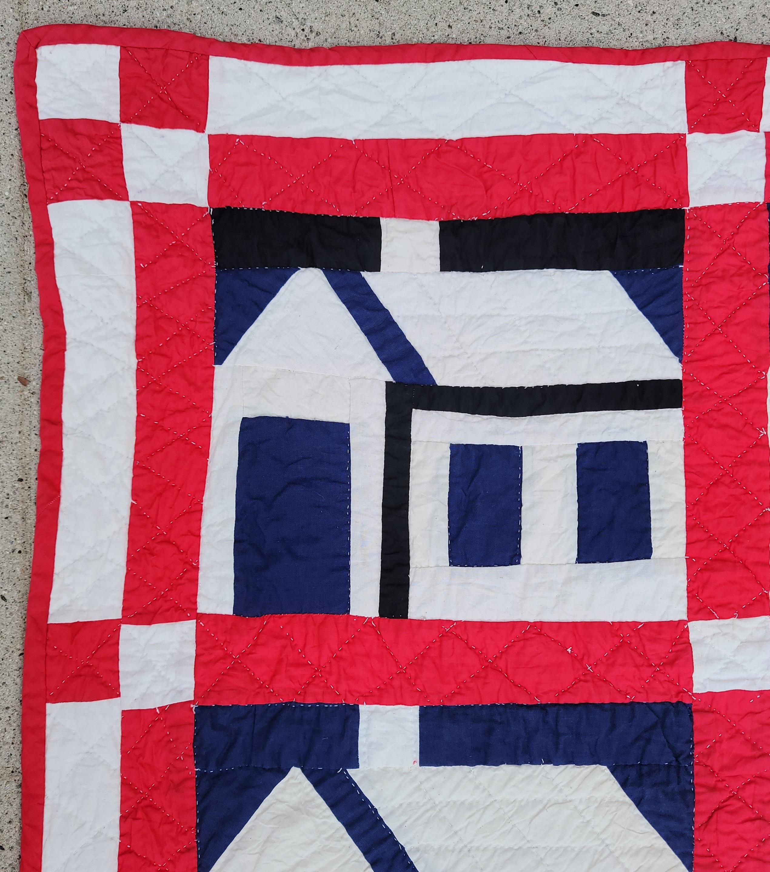 This folky school house quilt in red ,white & blue is in fine condition.We believe its from a mid west collection.