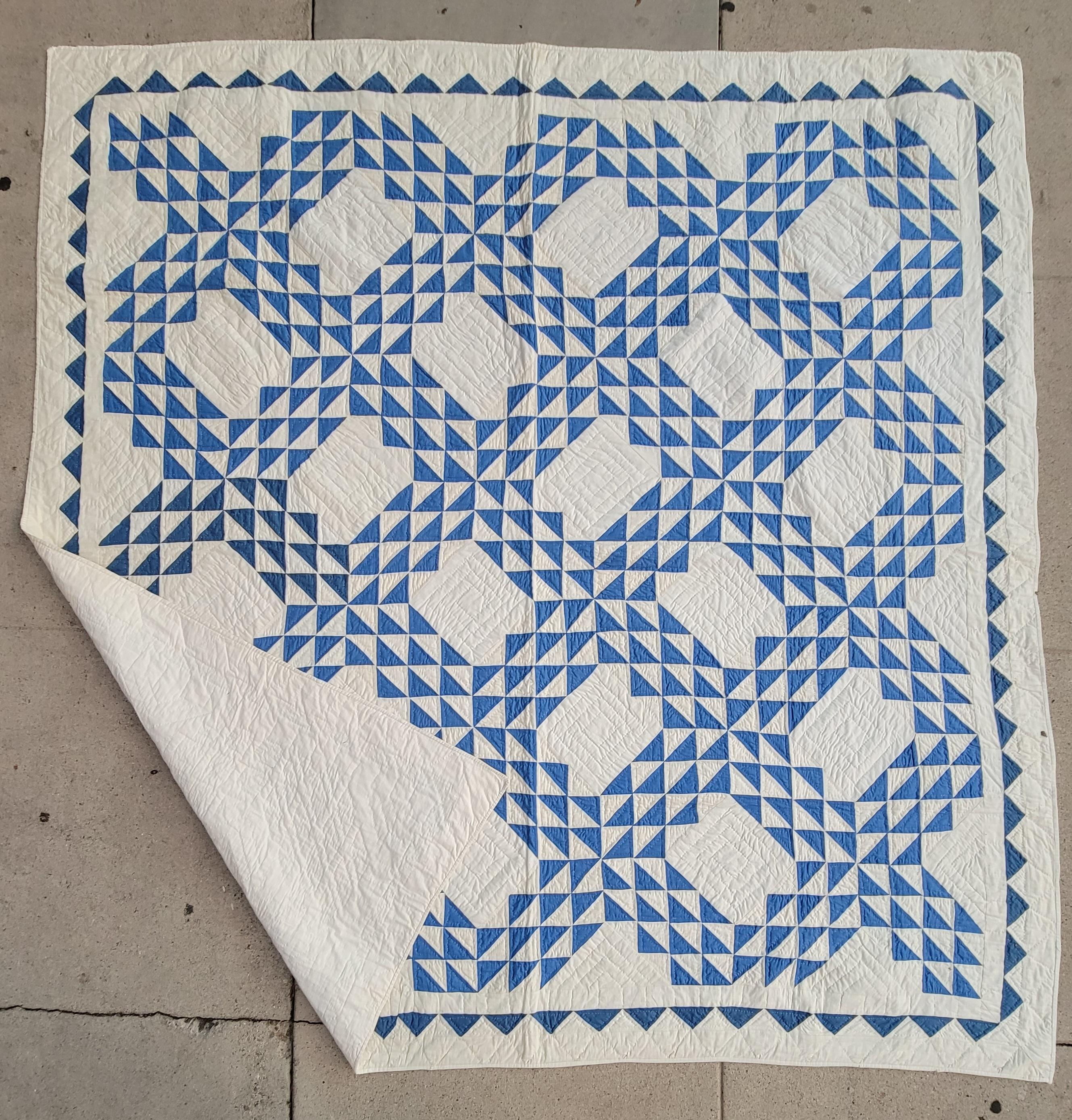 This fine small pieced robin egg blue & white ocean waves quilt is in pristine condition. It has fine quilting and a wonderful saw tooth inner border.
