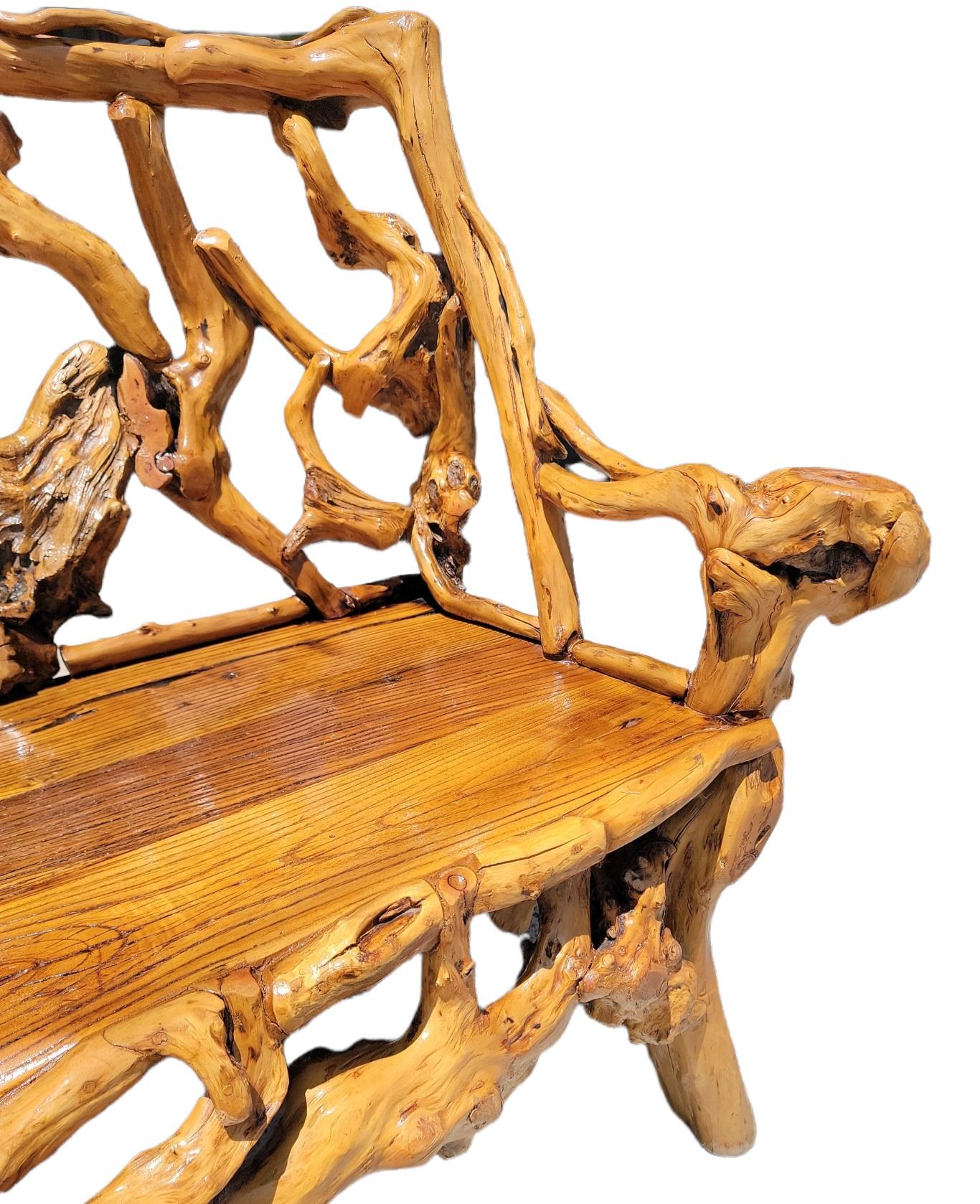 This Folk Art twig & hickory settee is in fine condition and is very sturdy. These settees were found in the mid west and in the south. The age ranges from the late 19thc up to the 1920's and 30's. The look great on a cabin porch or interior.