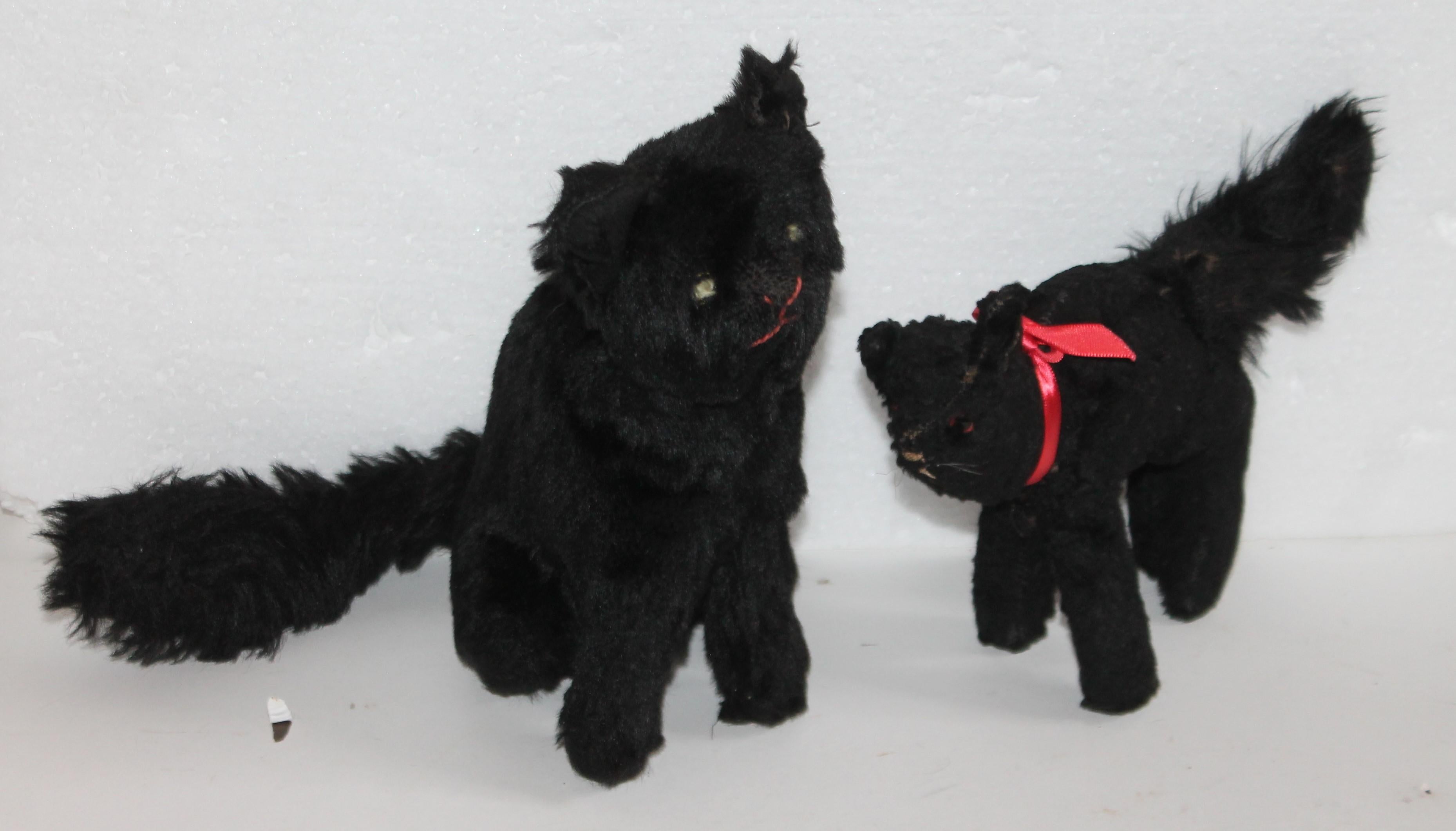 Two handmade black cats with glass eyes and hand sewn eyes with threading. The condition are very good. Just in time for Halloween!
