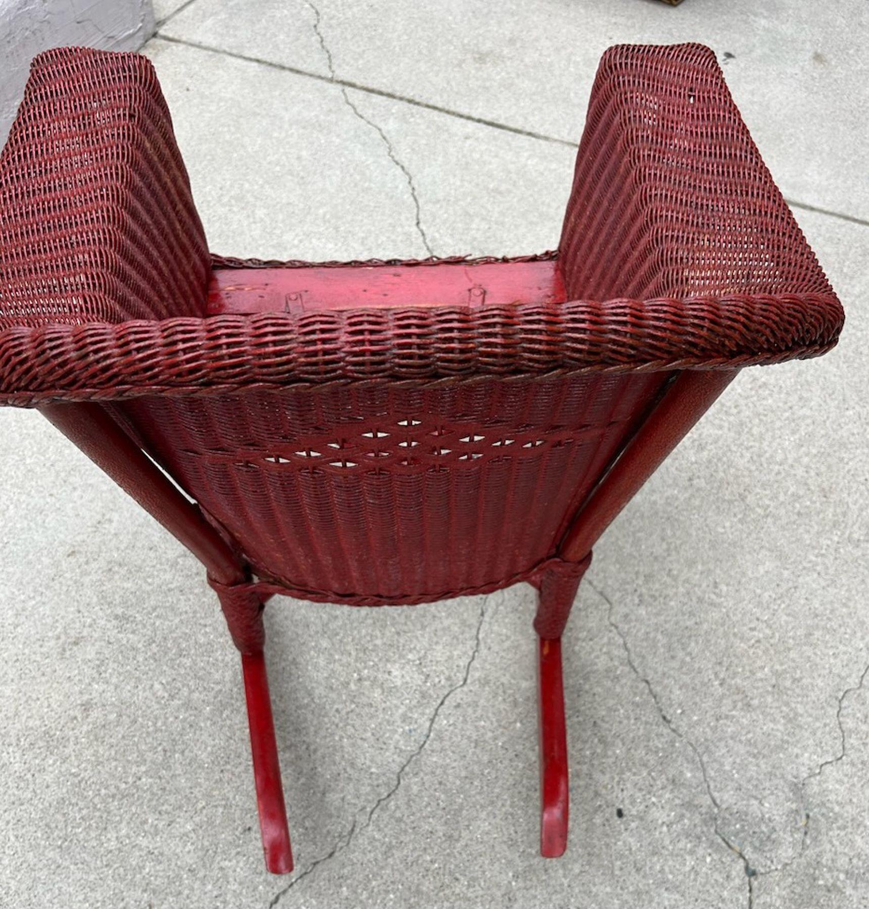 Early 20thc Wicker bar harbor Childs Rocking Chair. red painted wonderful size and great build quality. Great for out doors or indoors. 