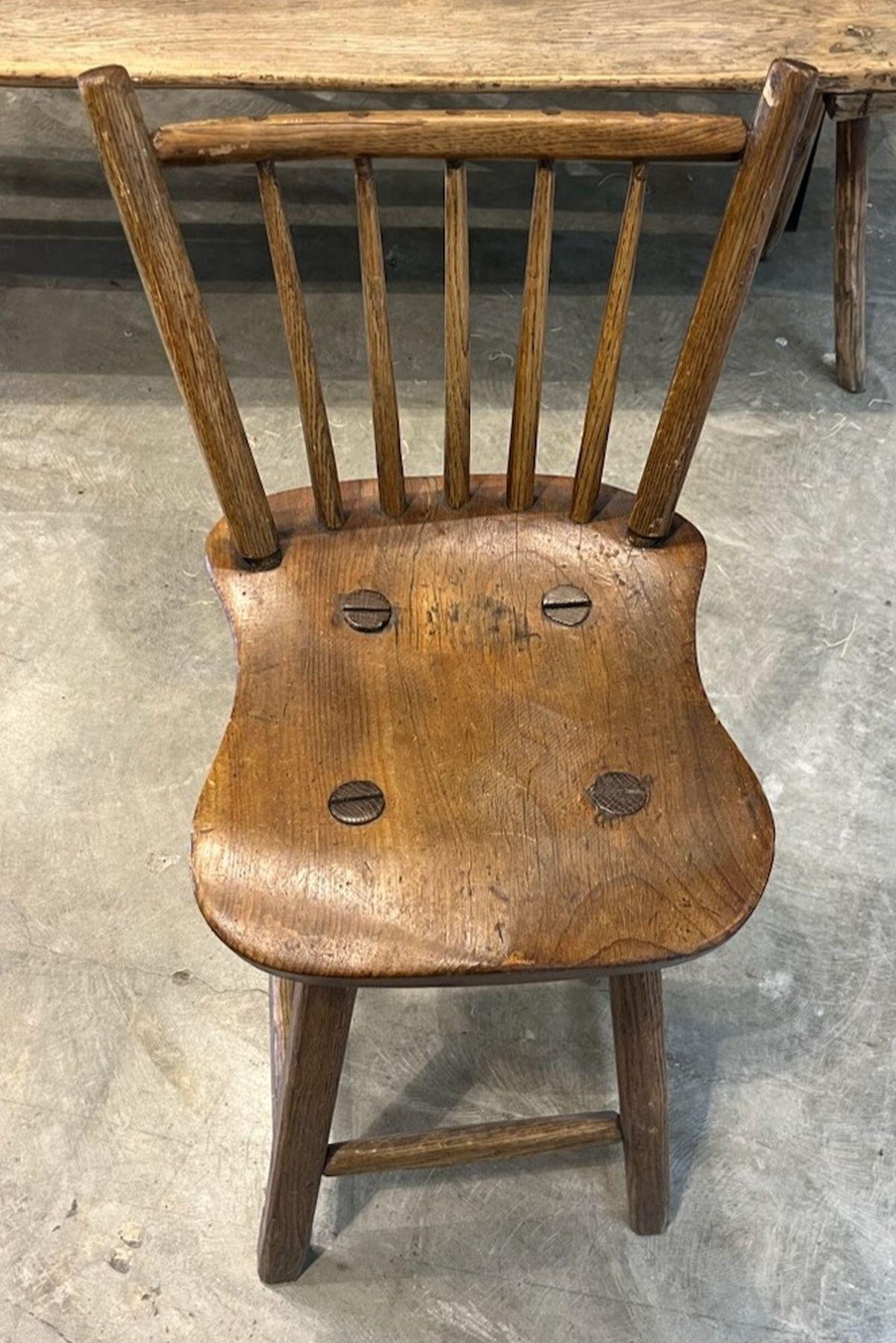 Early 20thc wooden hand made bar stool in very good condition. wooden peg construction. Very strong and sturdy.  great patina to the normal wear areas. 