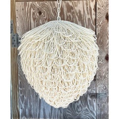 Early 21st Century Boho Finley Looped Rattan Chandelier After Arteriors