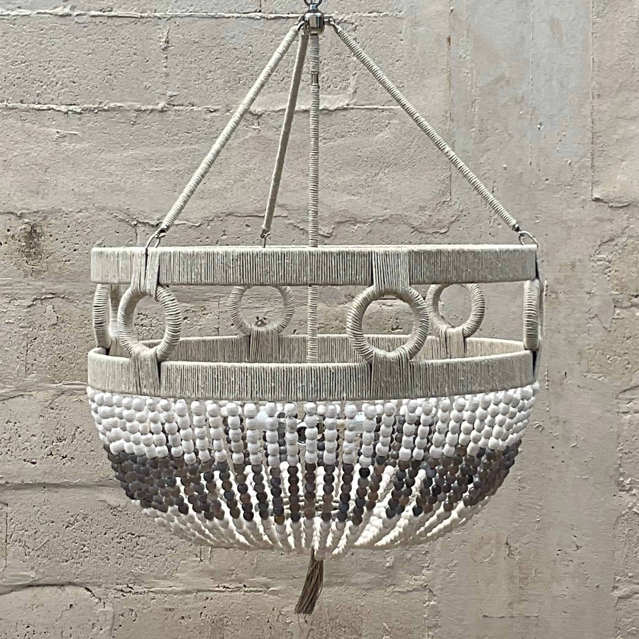 A stunning vintage Boho twine chandelier. Made by the iconic Ro Sham Beaux group. Beautiful twine wrapped frame with grey agate beading. Polished chrome hardware. Acquired from a Palm Beach estate.