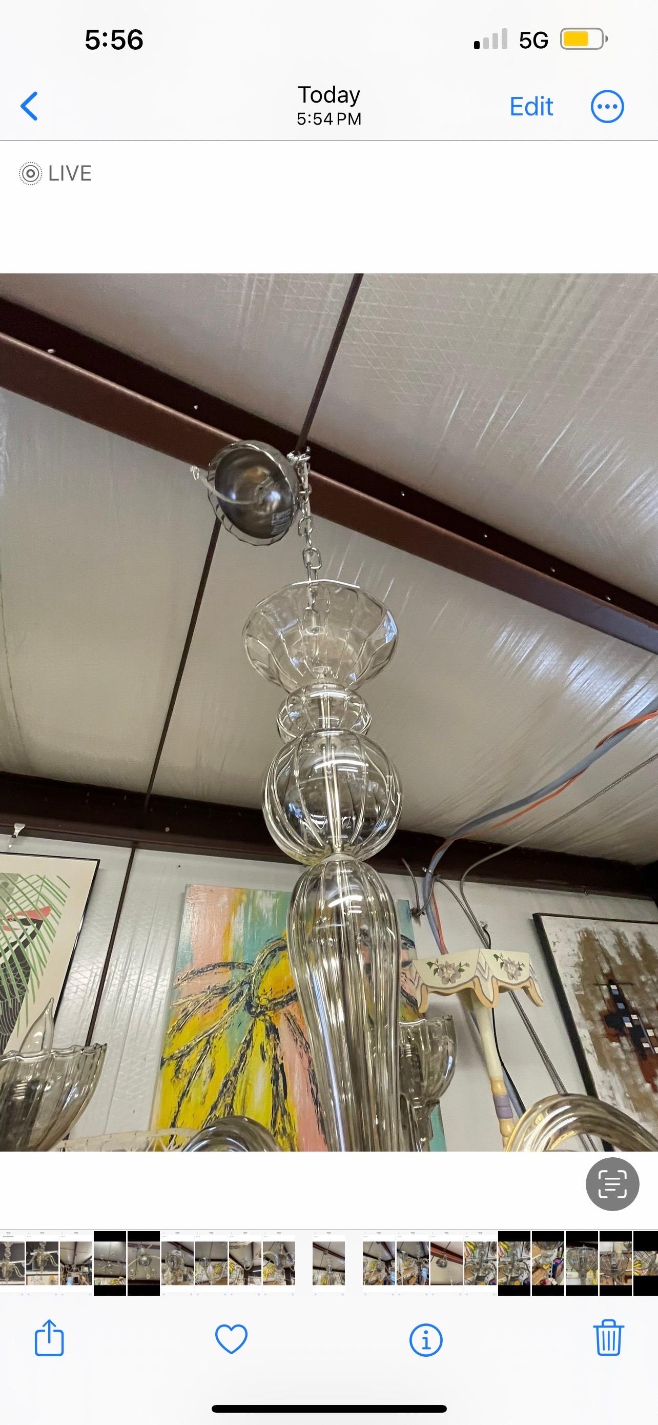 A wonderful and classic 6 light chandelier in hand blown smoked clear glass with silver.  This light is no longer in production and has been archived.  Circa 2001  Italy.   Marked on the glass canopy.  Measurements are without chain, but including