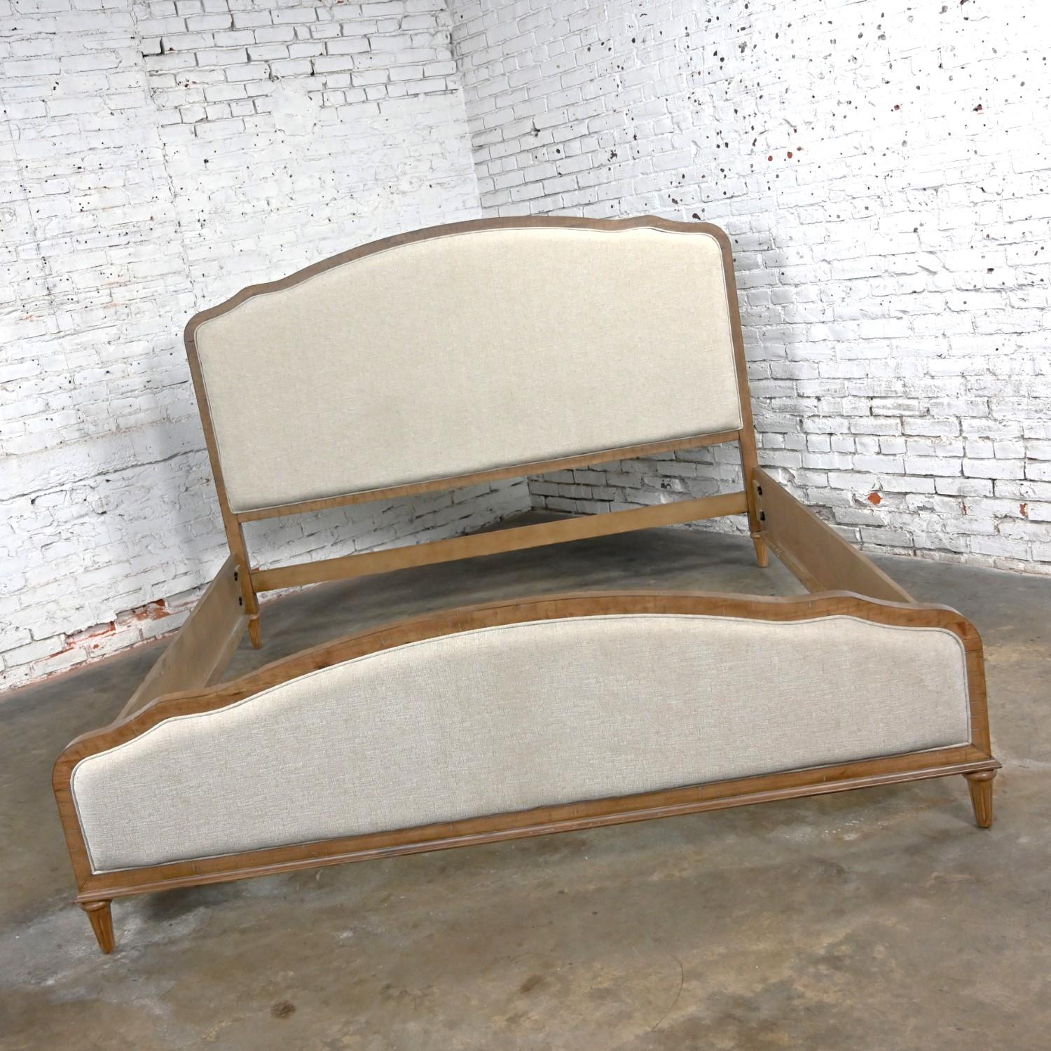 Exquisite Early 21st Century Modern French Country Rustic mahogany king sized upholstered bed including a portman panel headboard, footboard, and side rails. Beautiful condition, keeping in mind that this is vintage and not new so will have signs of