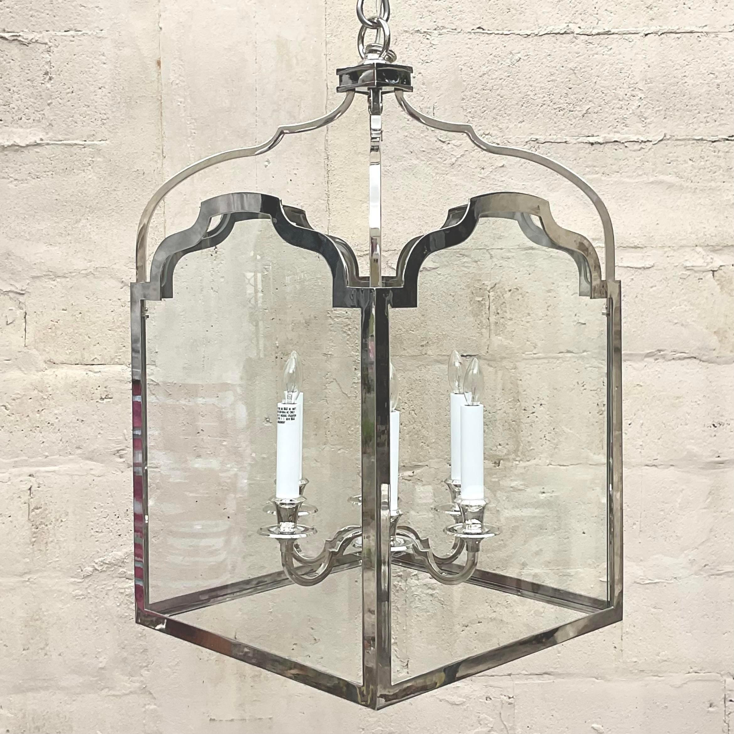 A fabulous vintage Regency lantern. A chic chrome indoor fixture with a gorgeous Chippendale shape. Made by the Visual Comfort group. Acquired from a Palm Beach estate. 