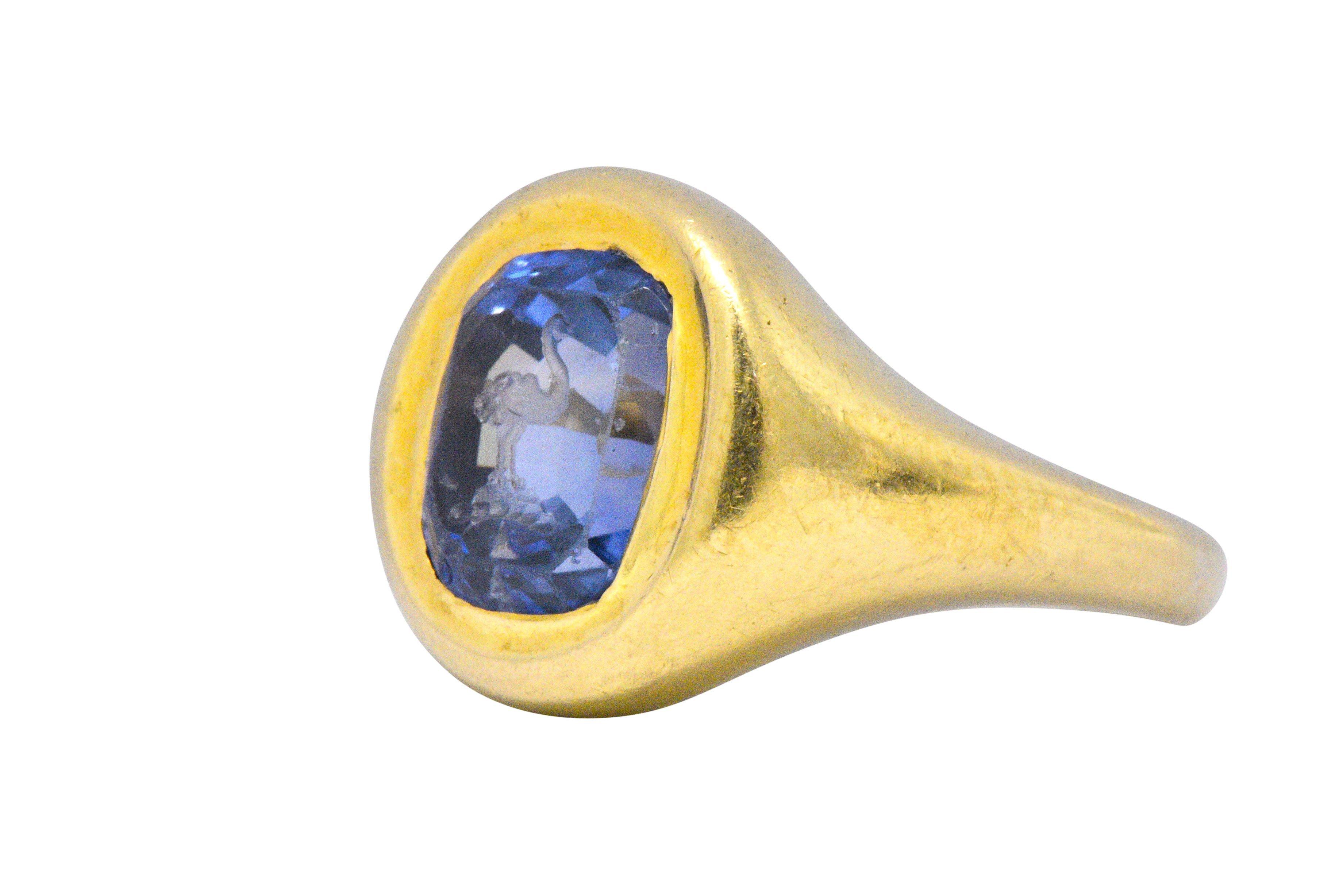 Early, rare antique carved sapphire ring

Centering a hand engraved mixed cut 6 carat natural blue Ceylon sapphire with no heat or clarity enhancements

Hand carved depiction of an ostrich or large bird

Some abrasions present

Measures 14 mm x 14.7