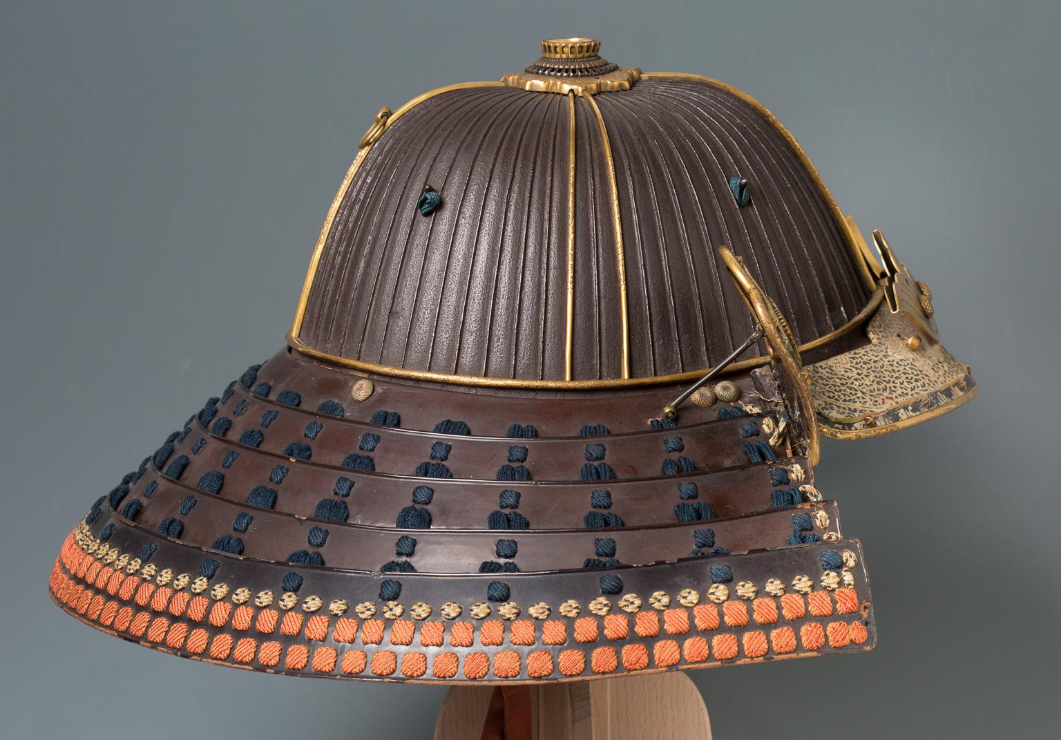 Suji-bachi kabuto
A 62-plates samurai helmet bearing the crest of the Nabeshima clan, circa 1570-1620.

Signed: Myochin Nobutaka

This excellent kabuto is signed by an unrecorded Japanese armorer and is hence an important documental piece. The