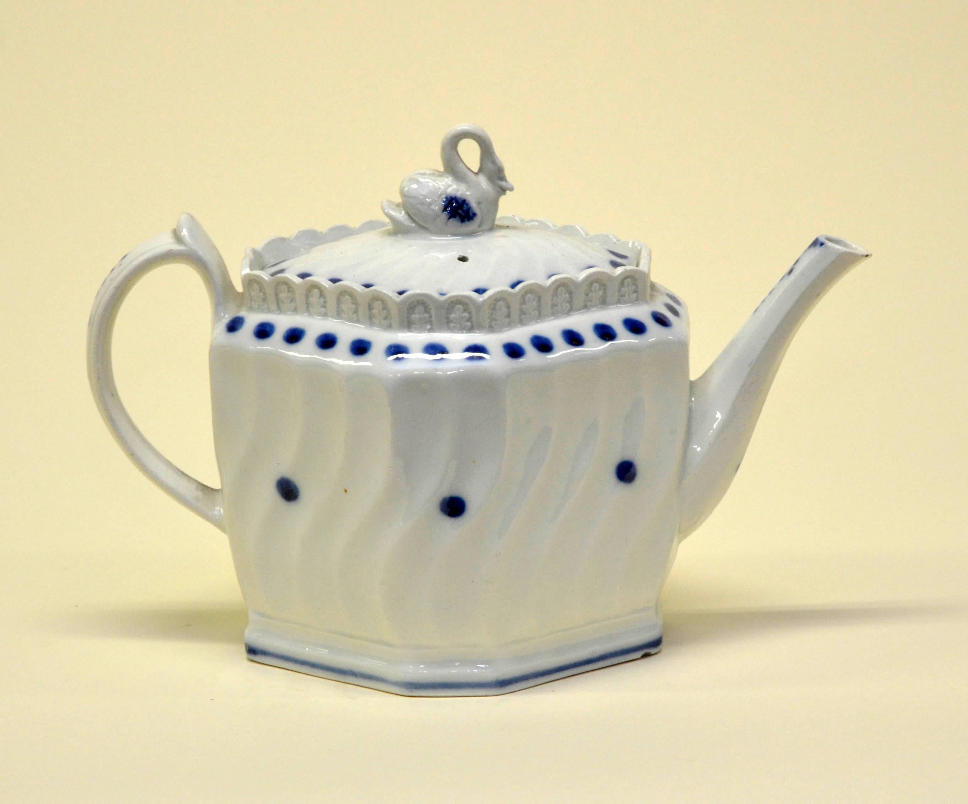 Early 1800 English possibly Thomas Harley blue and white octagonal lead-glazed earthenware teapot with swan finial.

Swan finial has been restored.

 