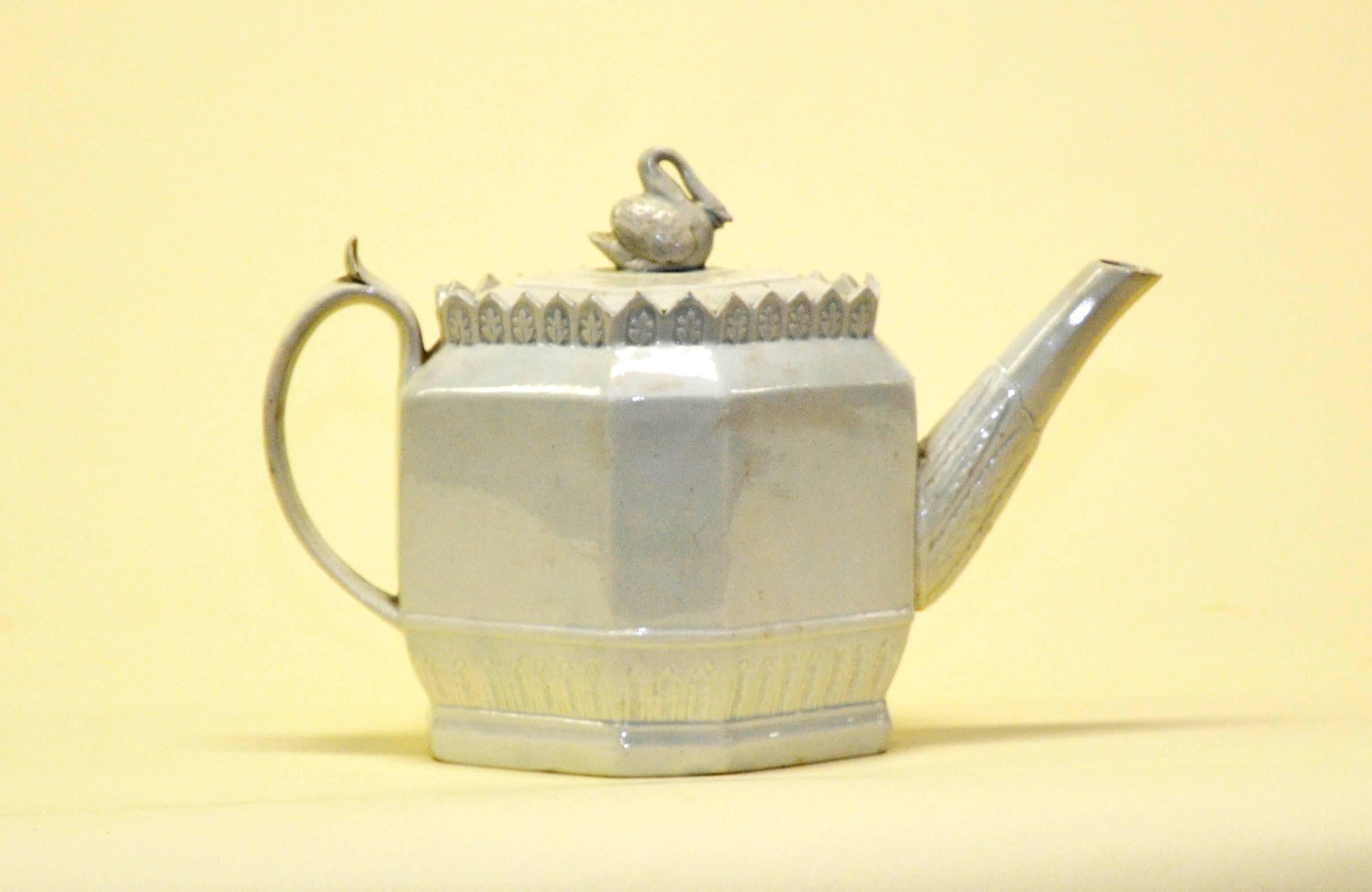 Early 1800 English possibly Thomas Harley creamware octagonal lead-glazed earthenware teapot with swan finial.

Swan finial has been restored.