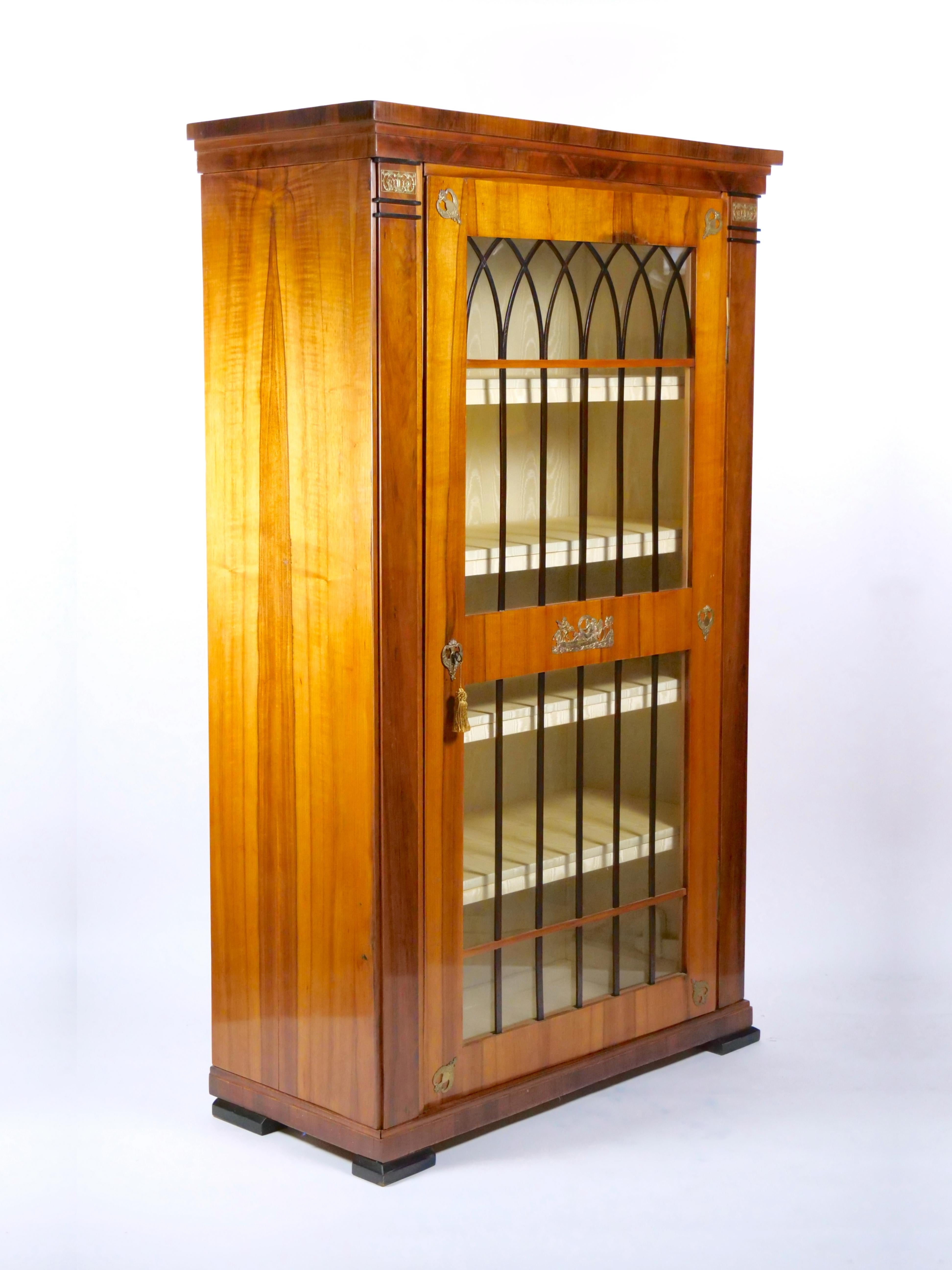 
Step into the world of the early 19th century with our impeccably crafted Biedermeier cabinet, hailing from the Austro-Hungarian, German, or Northern European origins. This exceptional piece is a true testament to the artistry and attention to