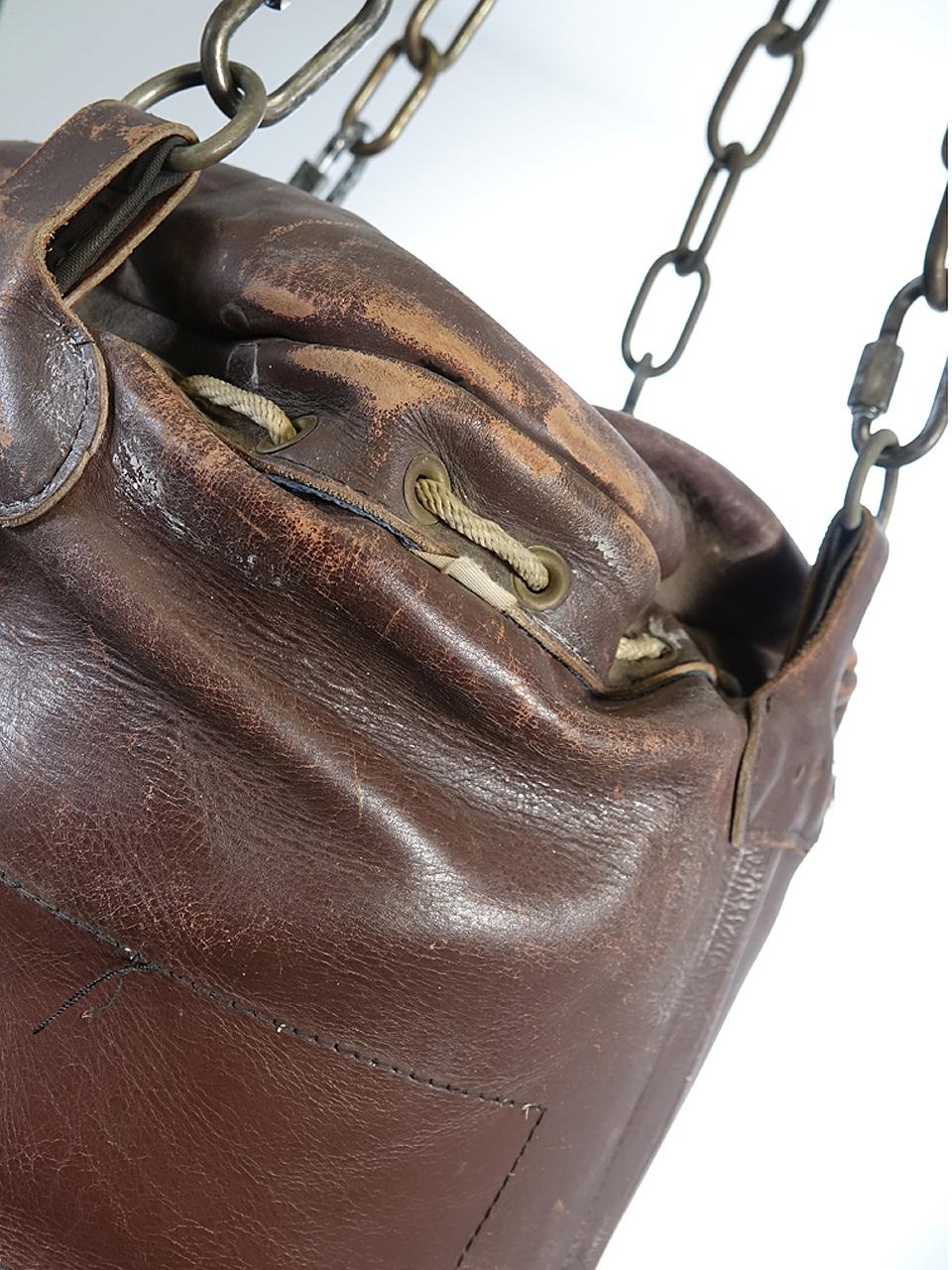 This is a nice early leather heavy bag. Its nicely broken in like an old baseball glove... just the way I like to find them. It's unsigned and has just the right look. You don't need to be a boxer to have one of these hanging around. But it's