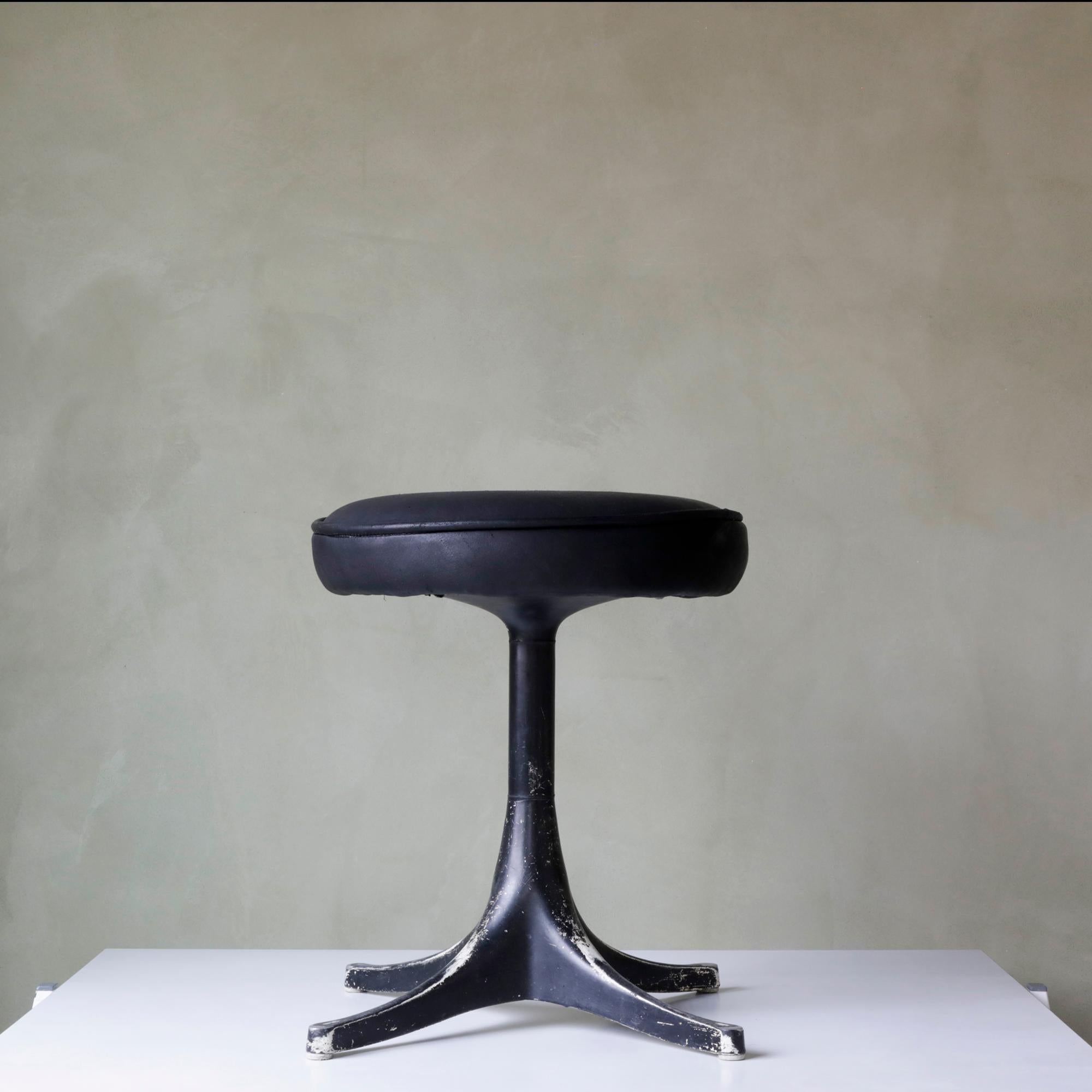 Early example of a cast-aluminum swag leg pedestal stool designed by George Nelson for Herman Miller. Great patina on the base showing nice wear in contrast to the new foam and black deerskin upholstery. This stool is ready for use and a great