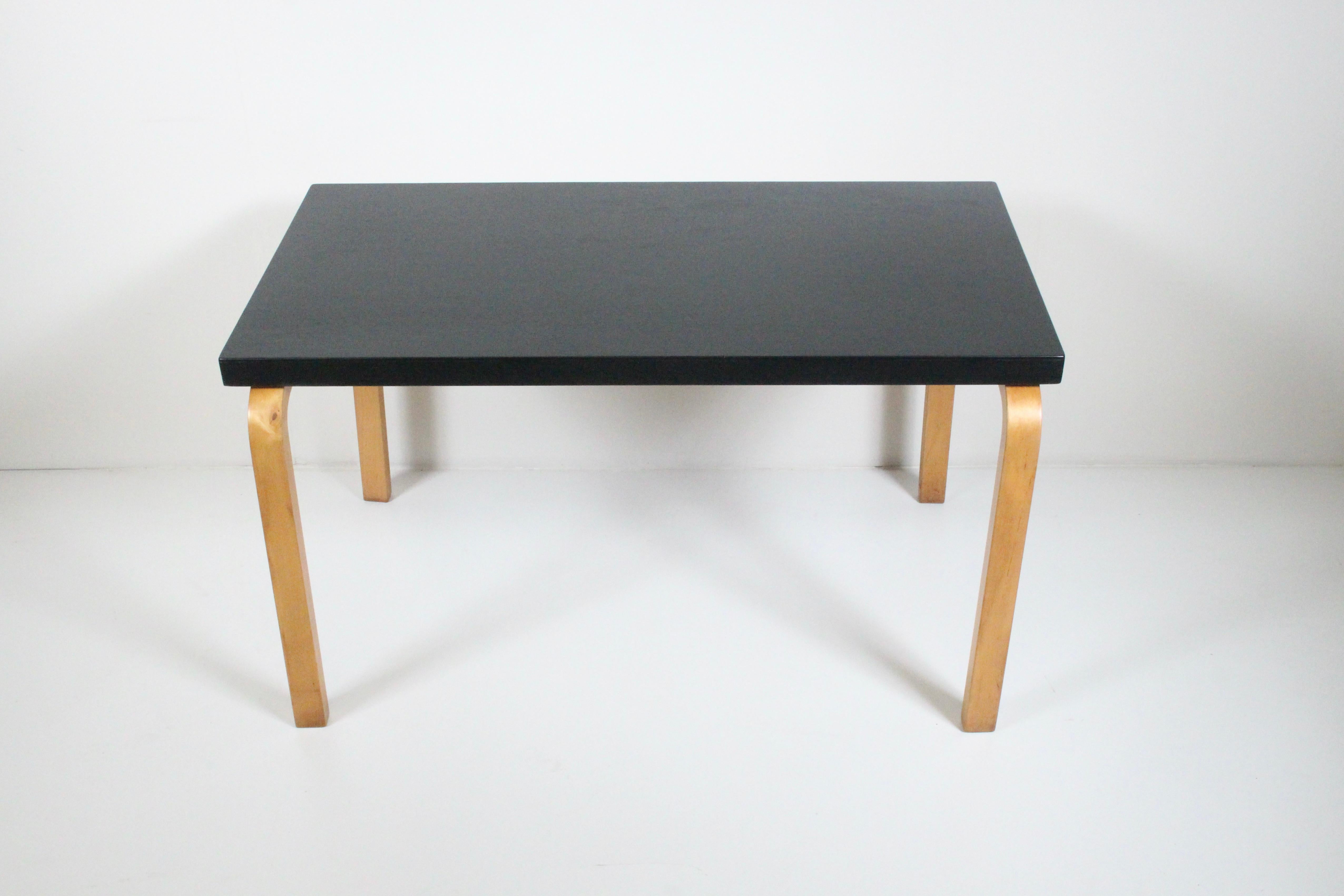 Early Alvar Aalto for Finsven Inc. Side Table. End Table. Coffee Table. Featuring a rectangular form, newly relacquered Black surface, multi layered Birch bentwood legs, with 7.5