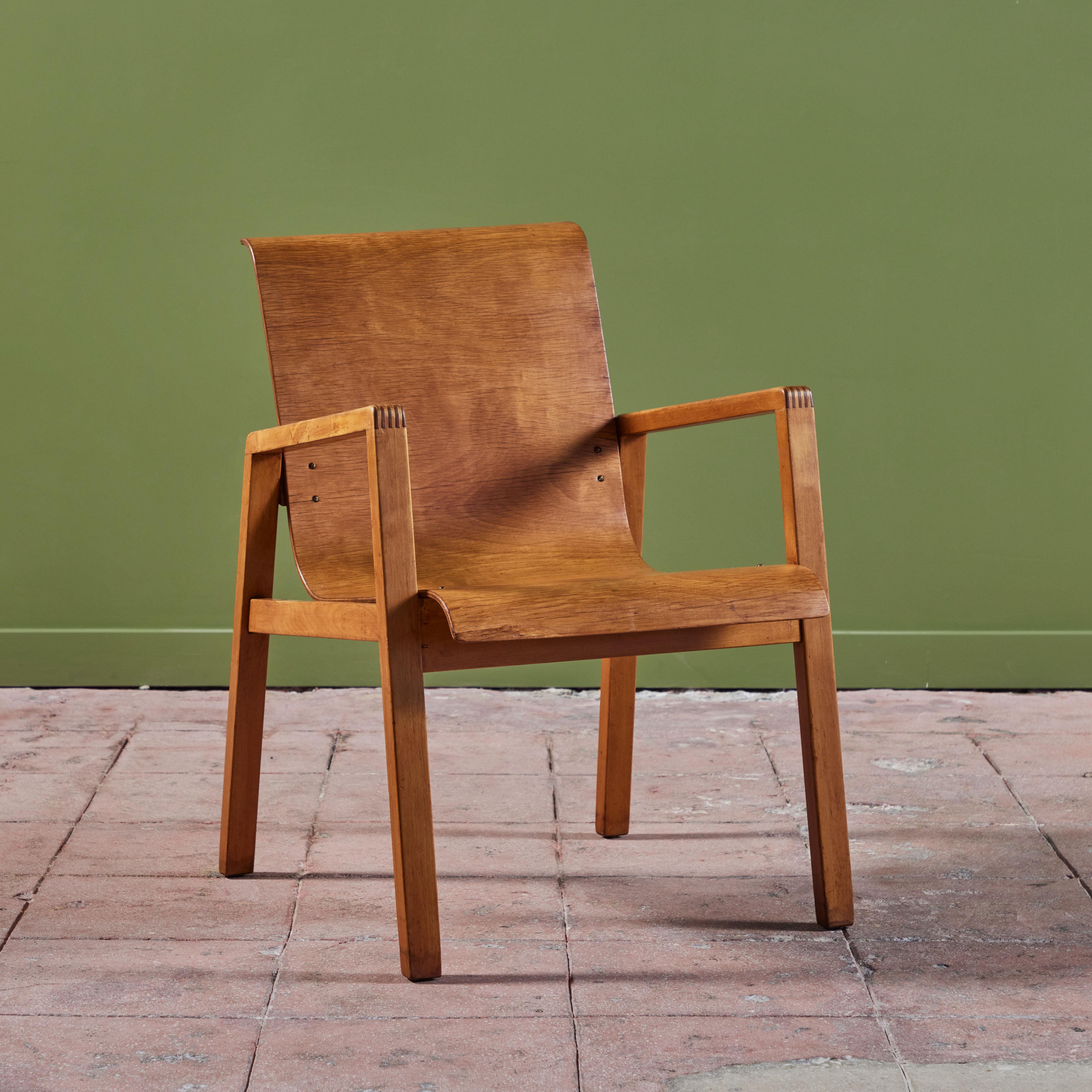 Finmar Model 403 'Hallway' chairs designed by Alvar Aalto and produced from 1930 through 1950 in Finland. The chair features a honey toned birch wood with bent plywood seat and backrest.

Dimensions
21