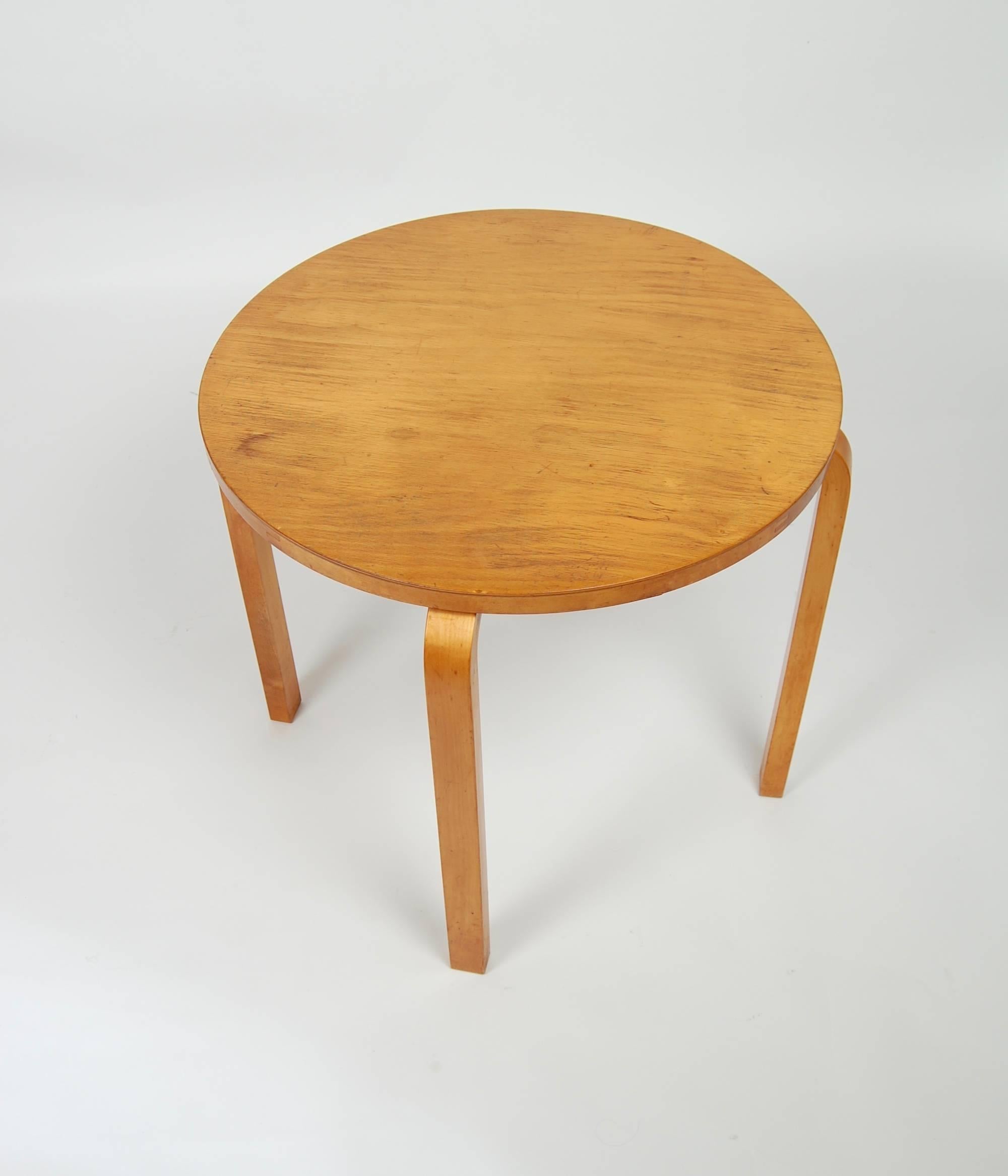 Designed in the 1930s and produced into the 1940s is this series 70 Alvar Aalto side table. Constructed of laminated birch with bent wood legs from Aalto's early design career. Great patina to the surfaces and in unusually good condition for a piece