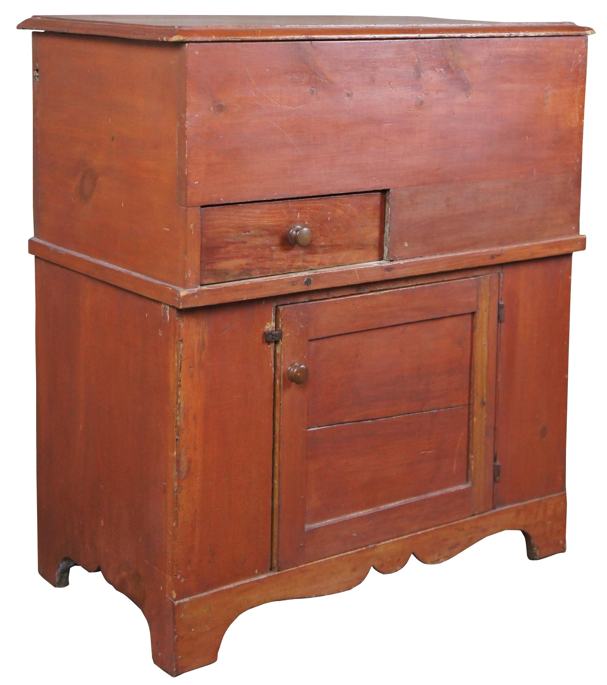 19th century Pennsylvania pine Primitive painted Lift top commode. Includes upper compartment with built in drawer over lower cabinet and carved aprons.
  