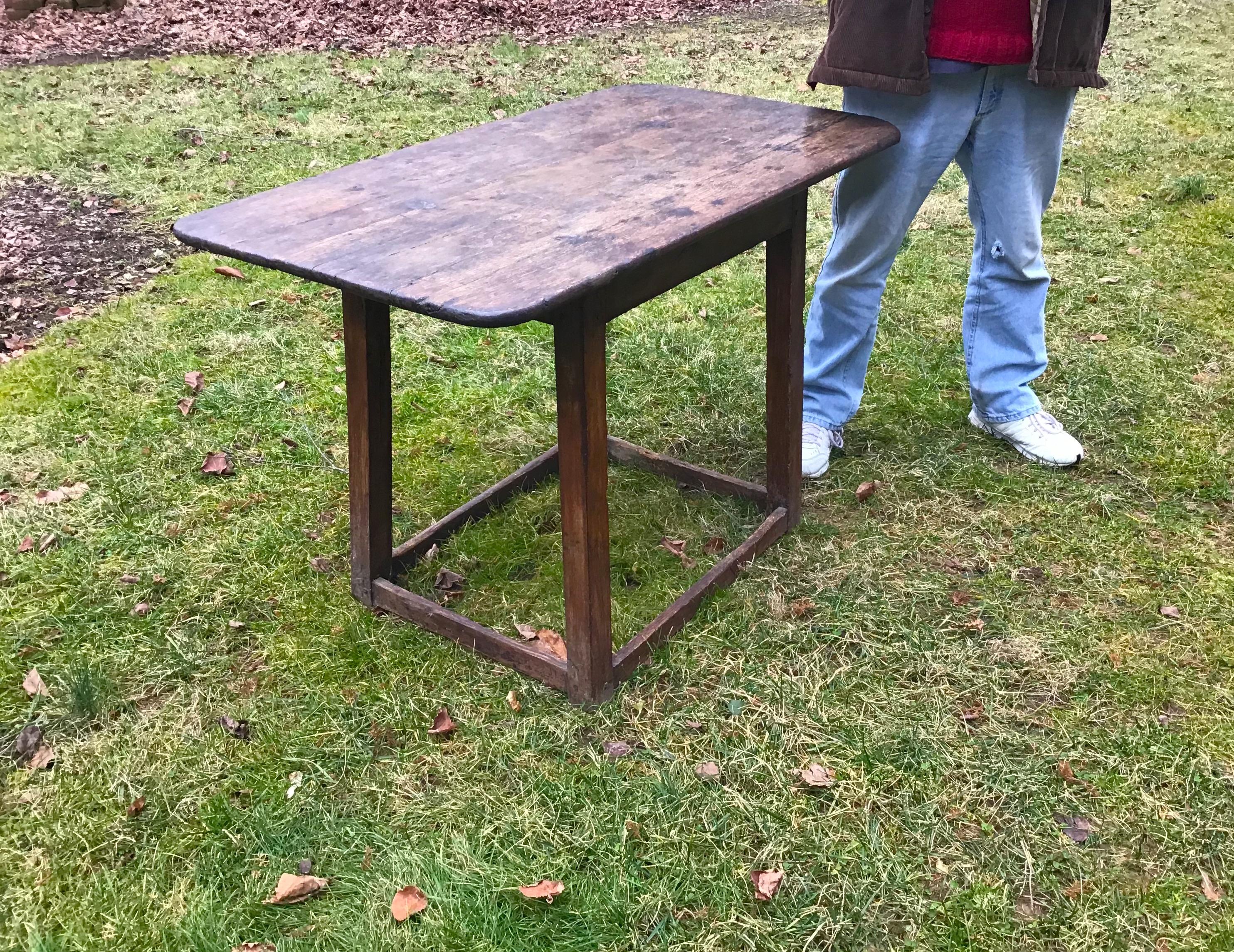 An 18th century early American tavern table, an antique primitive and rustic handmade table from eastern Long Island, New York.

 