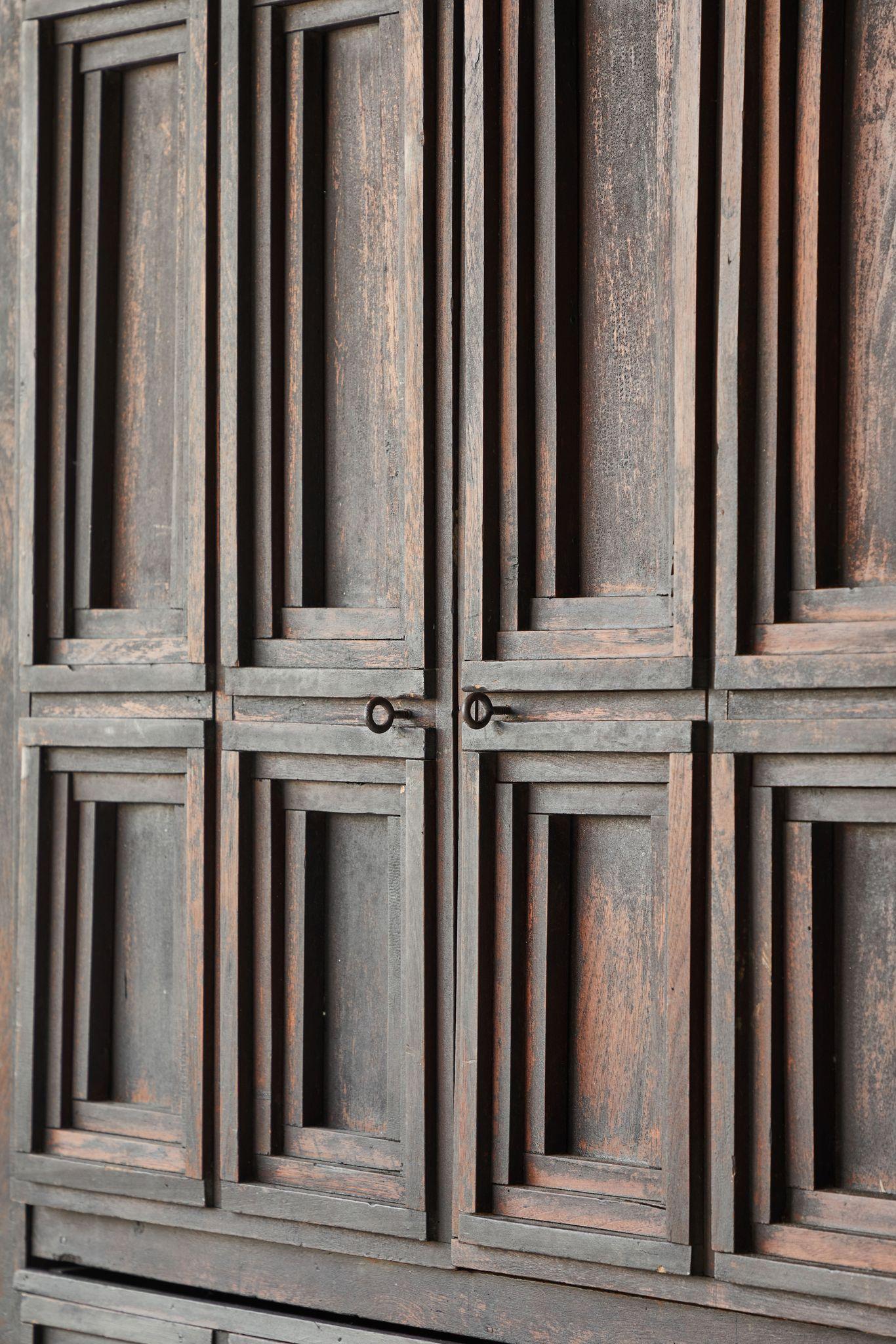 Early American Arts & Crafts cabinet with four doors and a single middle drawer. The cabinet exudes an arts sand crafts feel with each moulding applied individually to the face of the cabinet in a concentric pattern.