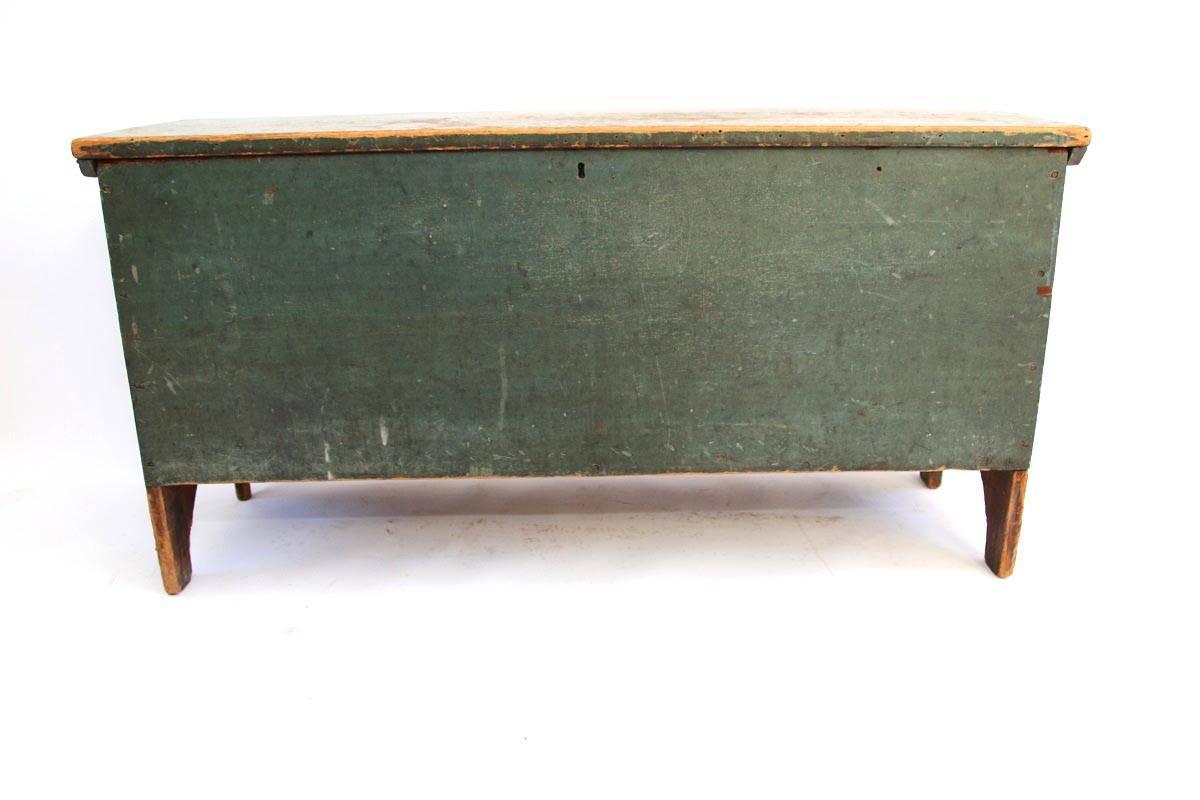 Early American blue-green painted pine blanket chest with arched ends. Old, if not original paint surface. Square nails used in construction. 

 Old loss to left rear leg as shown in photographs. 

Likely New England, circa 1820.