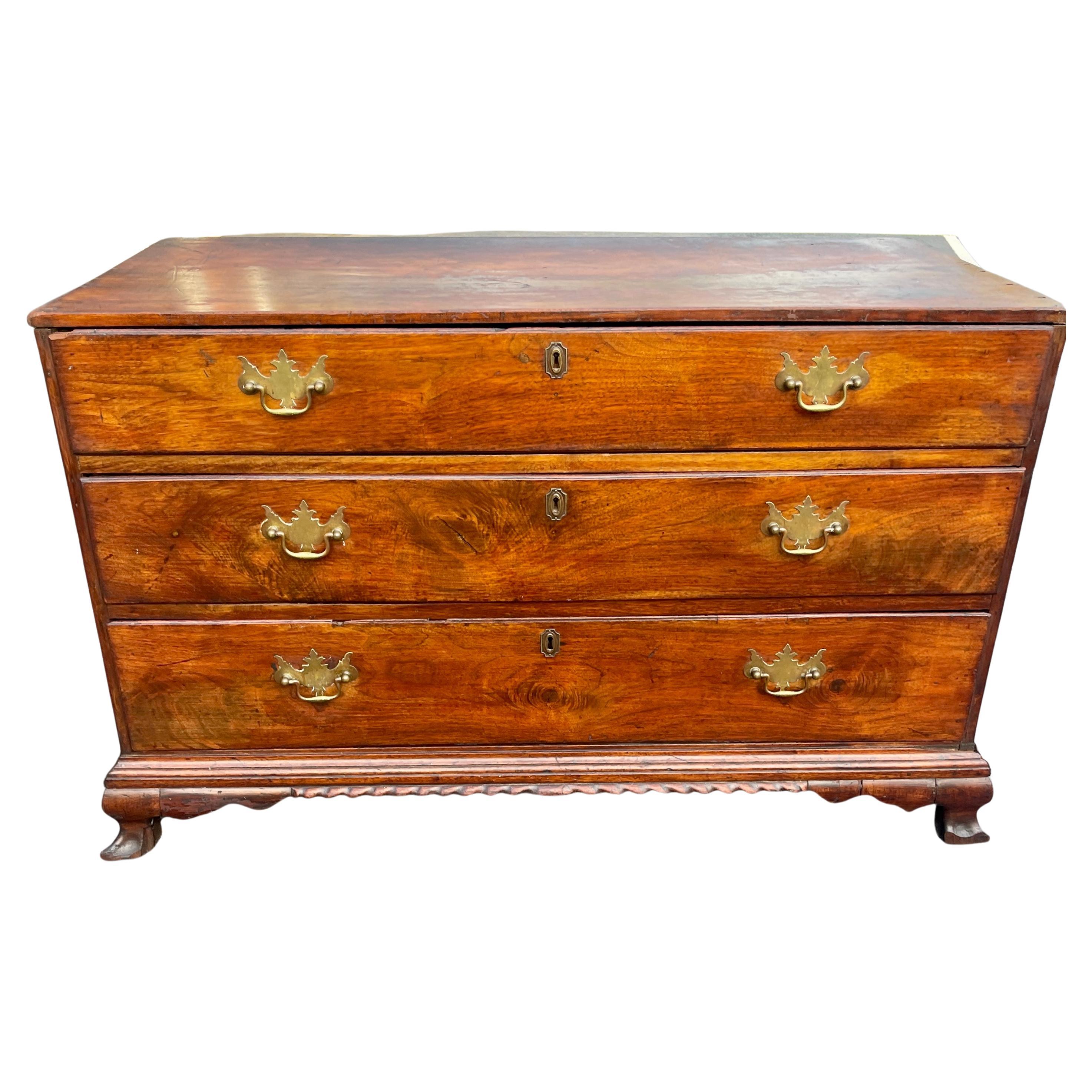 American Federal chest of drawers. This charming three drawer chest has original brass hardware. The beautiful antique low dresser or chest is in wonderful original vintage condition. The brass keyhole hardware is of later date. The three drawer