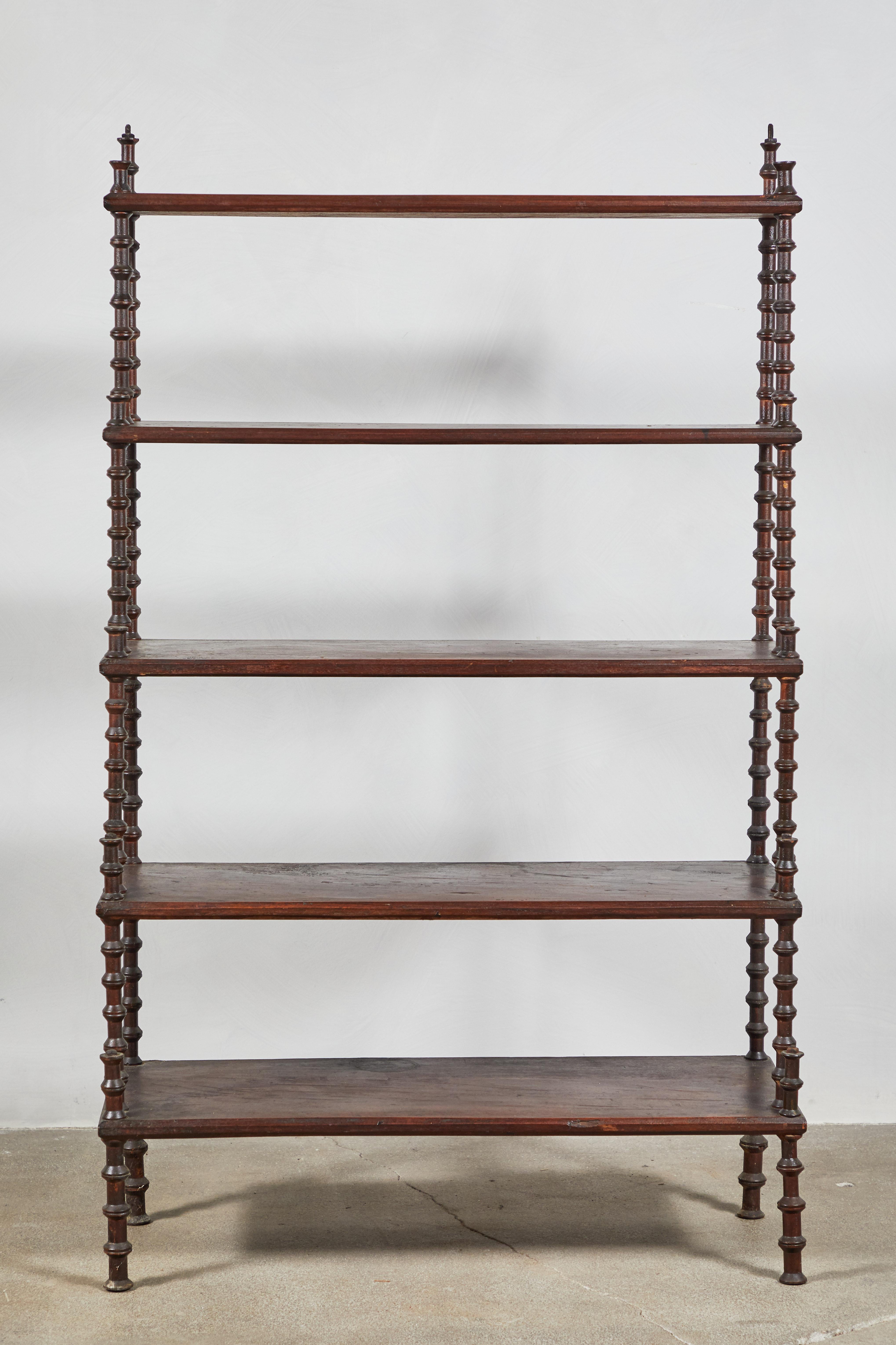 Early American five-tiered step spool shelf. The shelf offers a Folk Art charm.