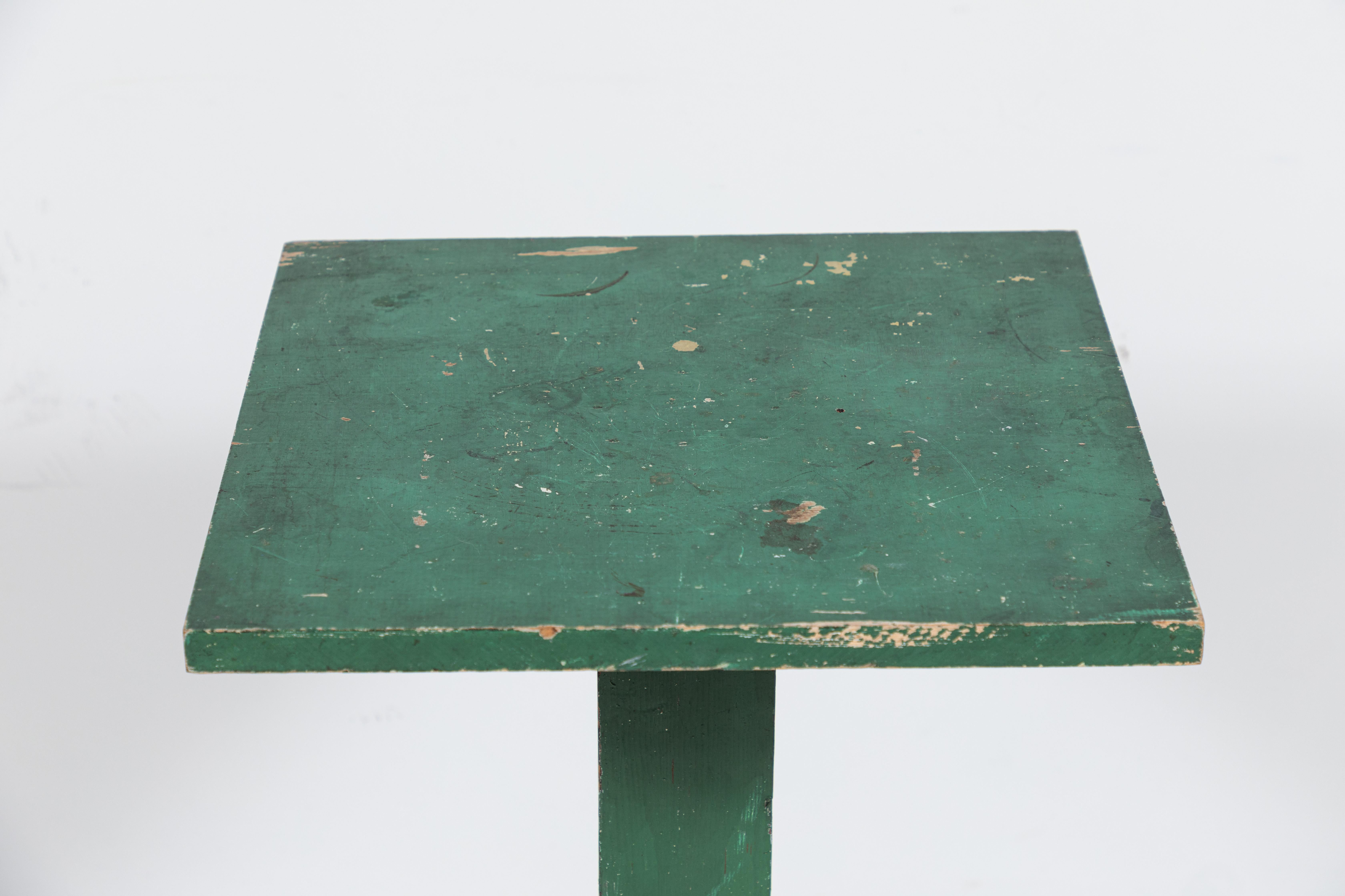 Early American green painted pedestal table. Simple construction, the table offers a bit of history and patina.