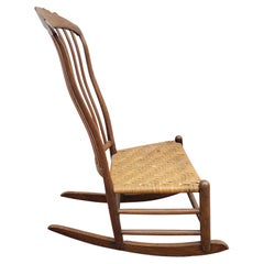 Mecedora con asiento de roble americano y caña partida, circa años 60