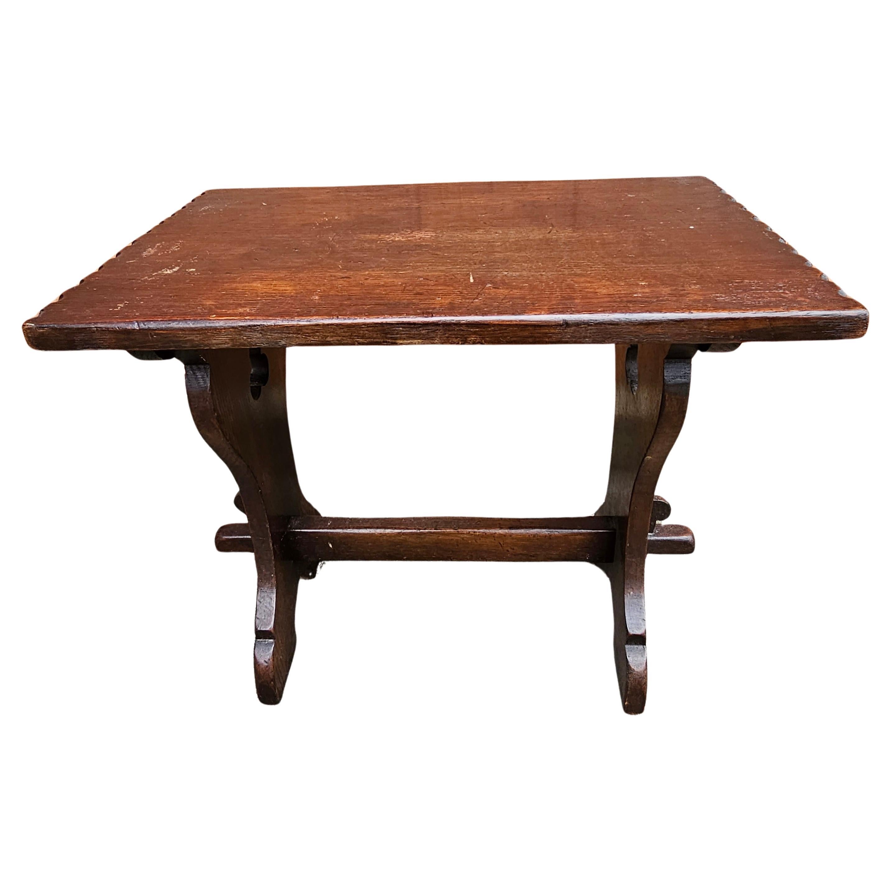 An Early American Oak Trestle Side Table or bench in very stable condition. 
Solid hand crafted table. Measures 20.5
