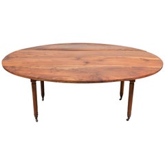 Early American Oval Mahogany Drop Leaf Table with Turned Legs on Casters
