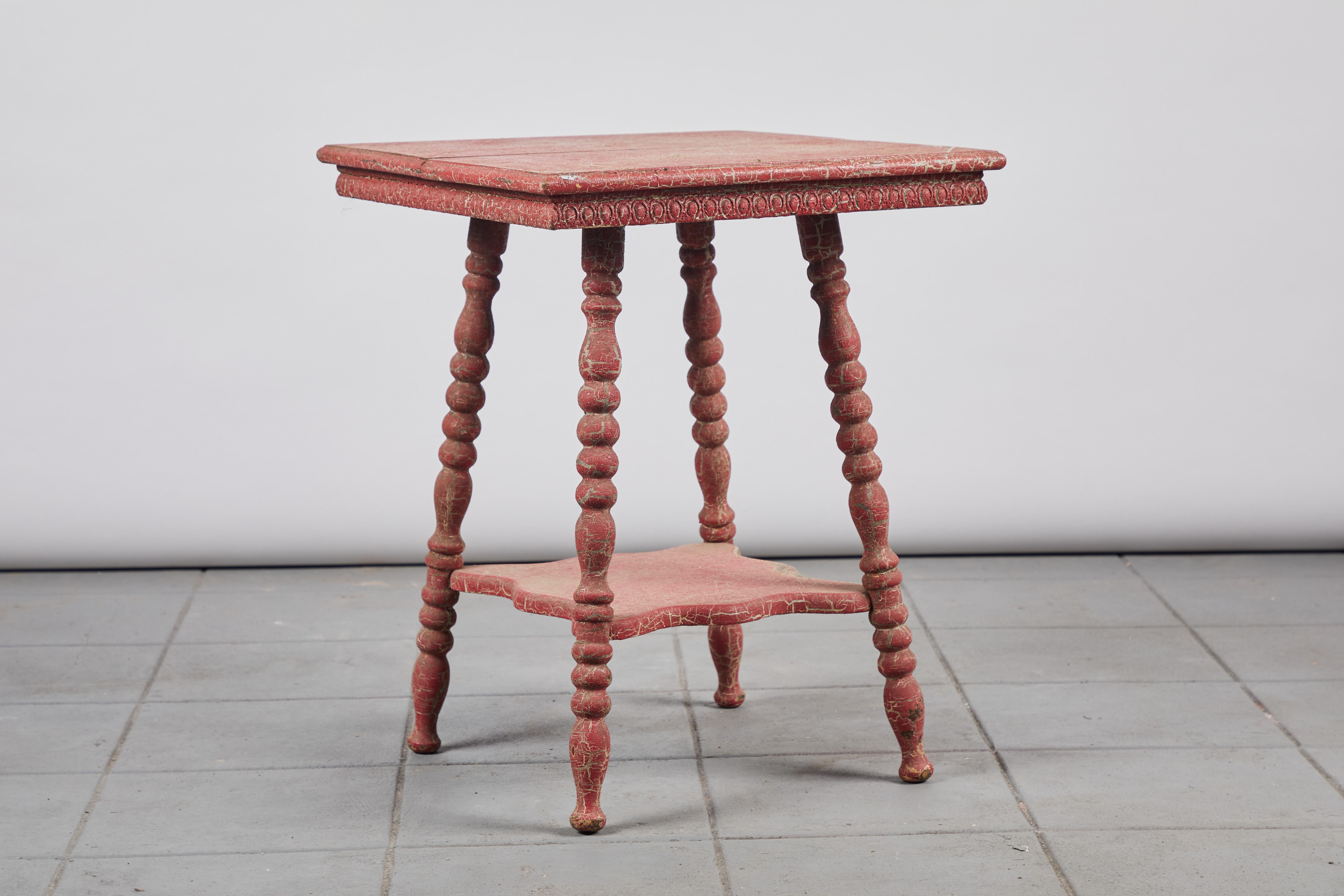 Early American red painted square side table with spindle legs and scalloped shaped lower shelf.